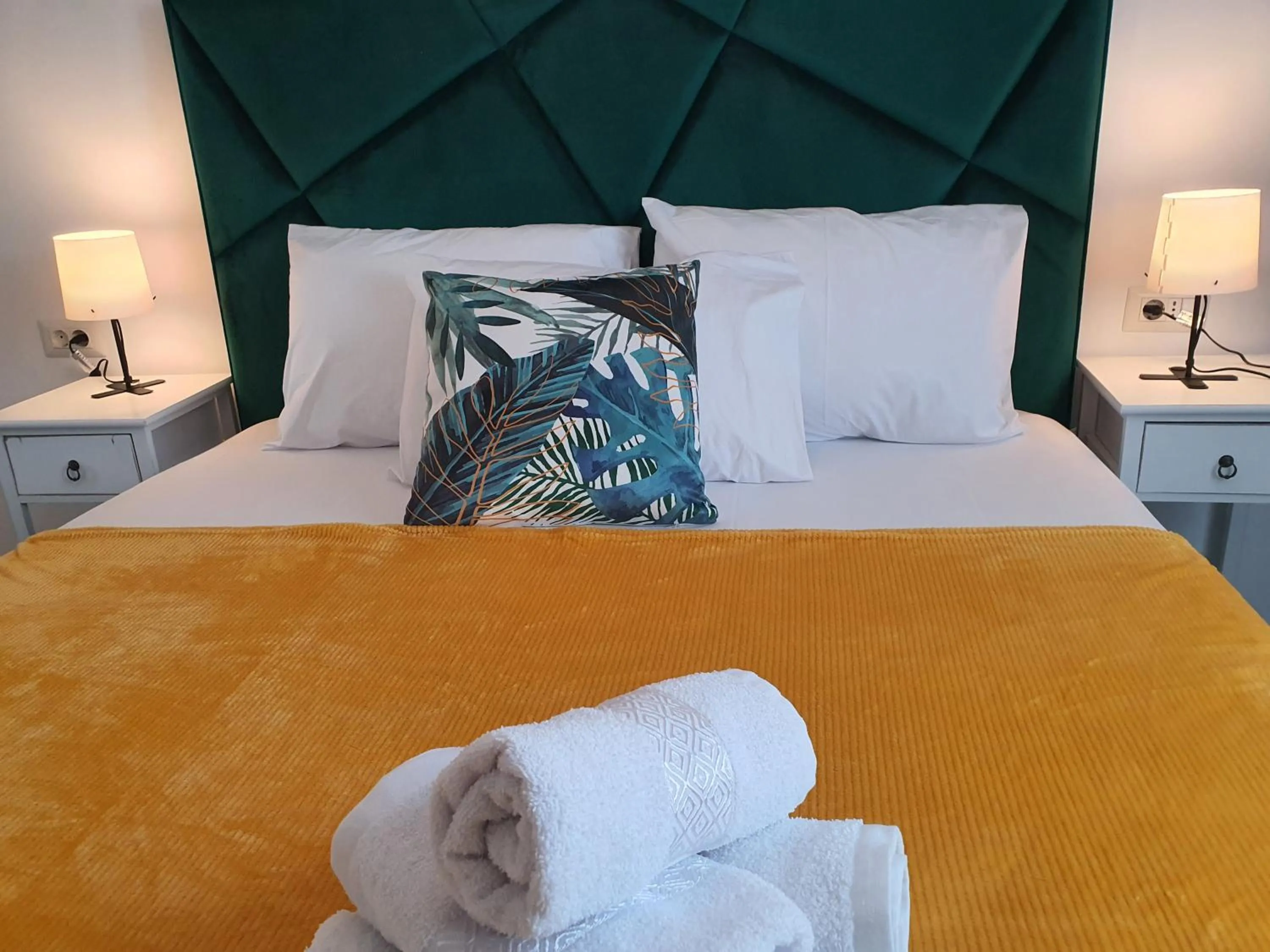 Bed in Grey Residence Apartments