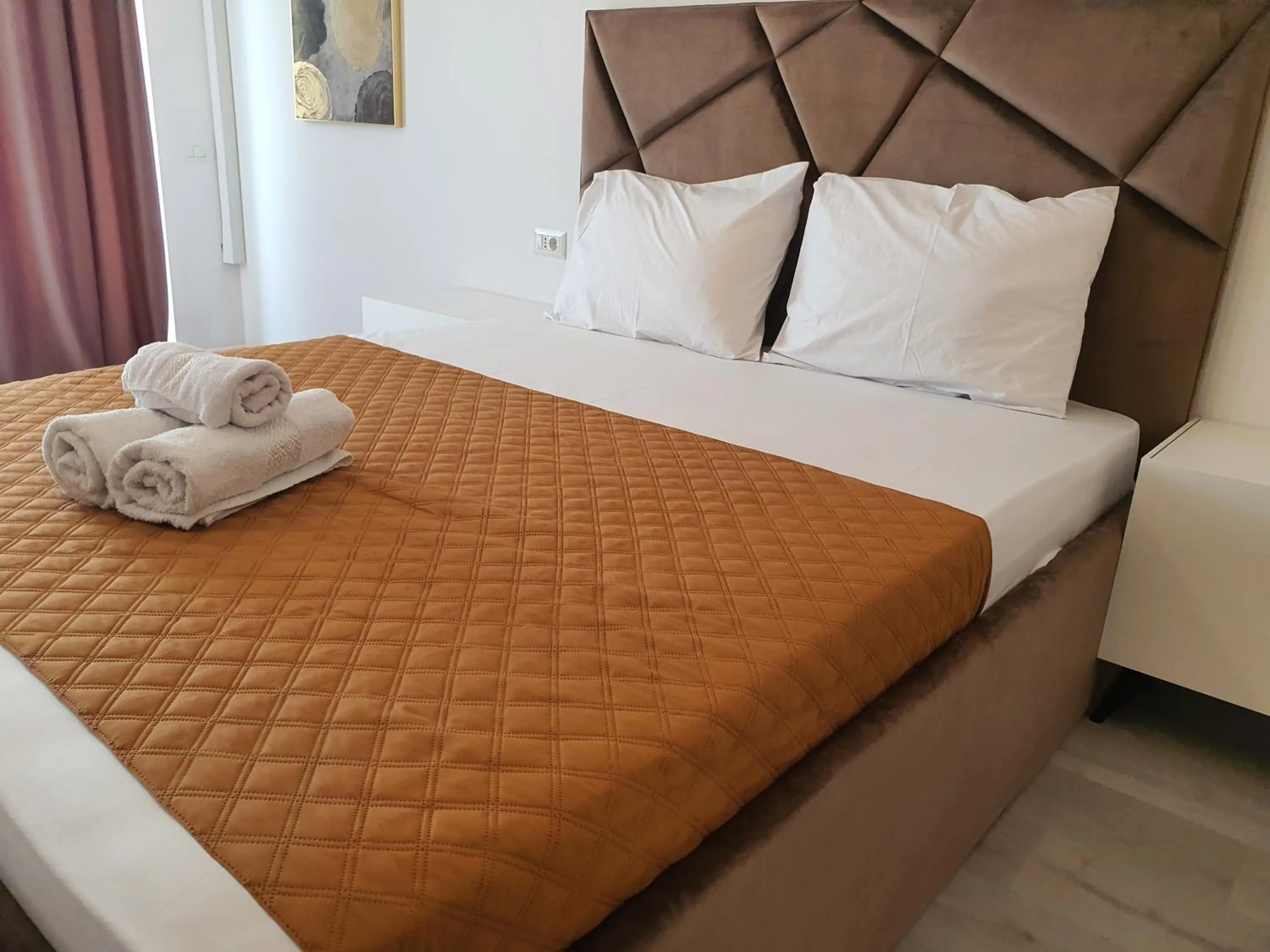 Bed in Grey Residence Apartments