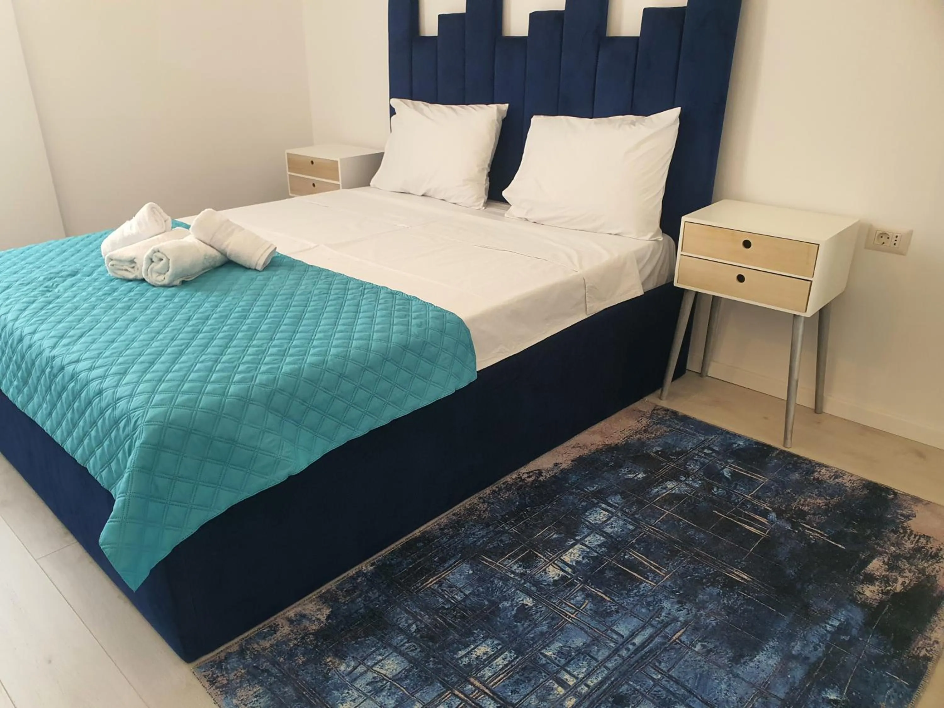 Bed in Grey Residence Apartments