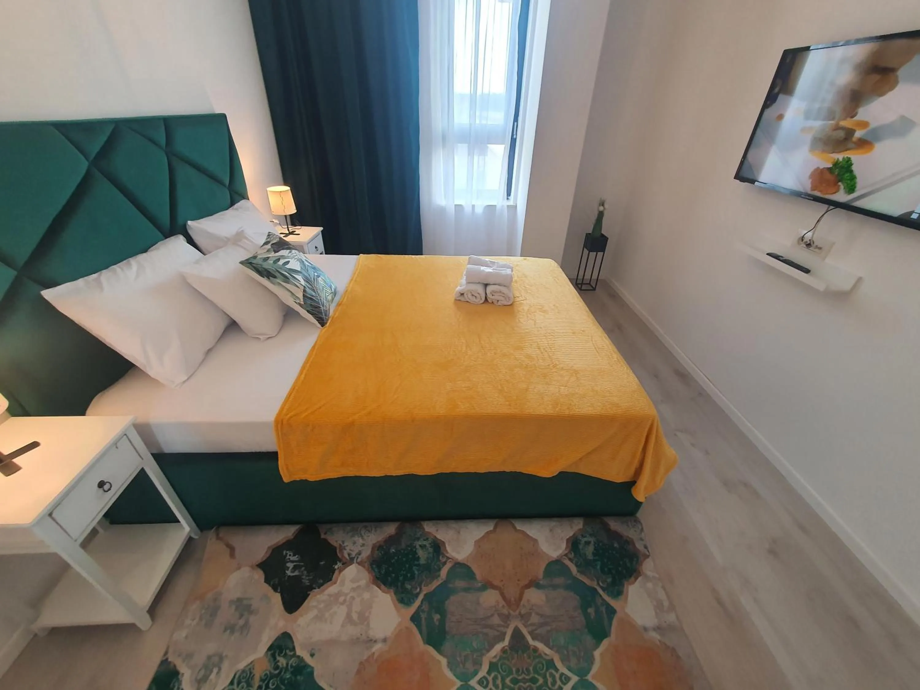 Bed in Grey Residence Apartments