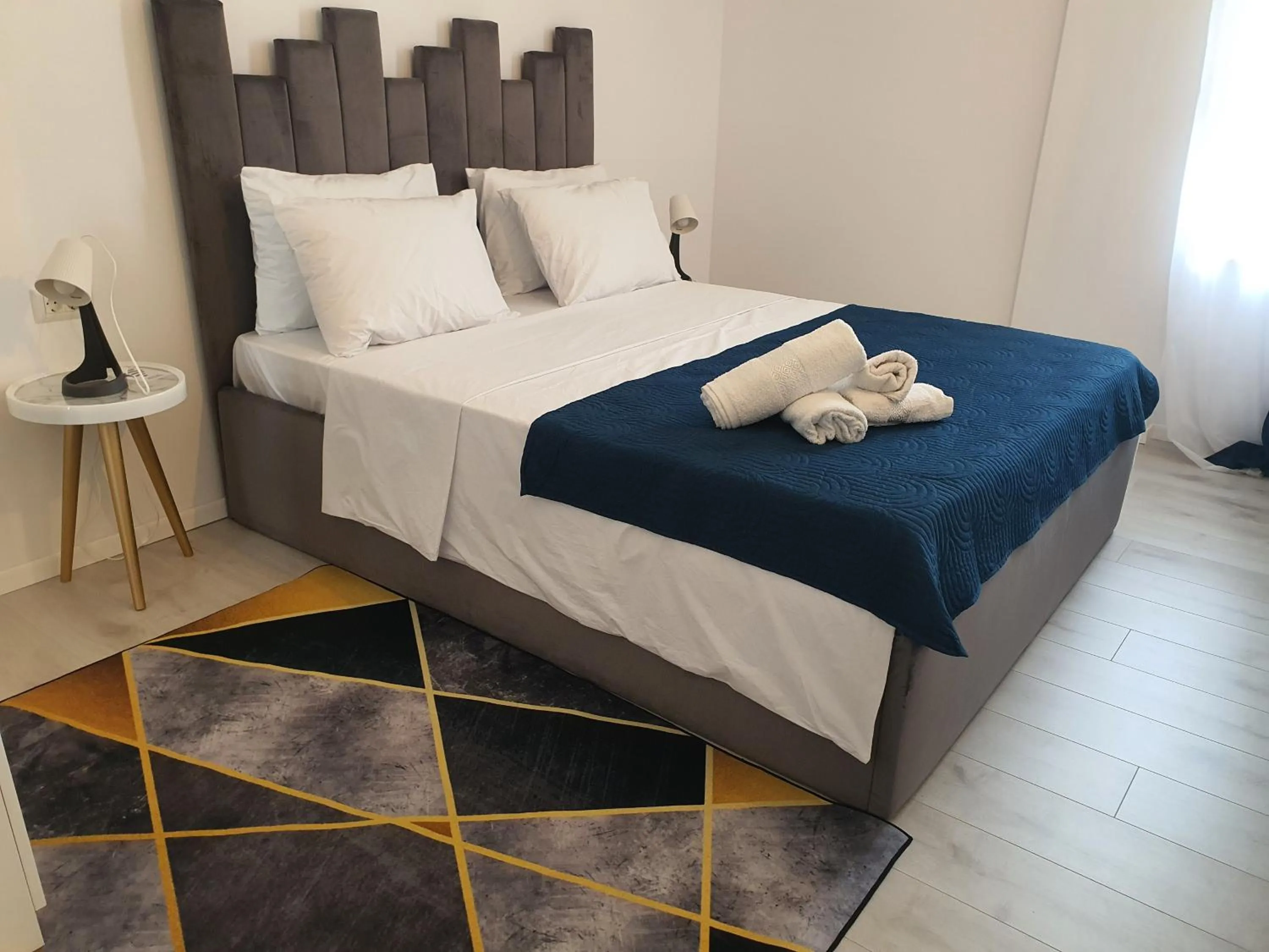 Bed in Grey Residence Apartments