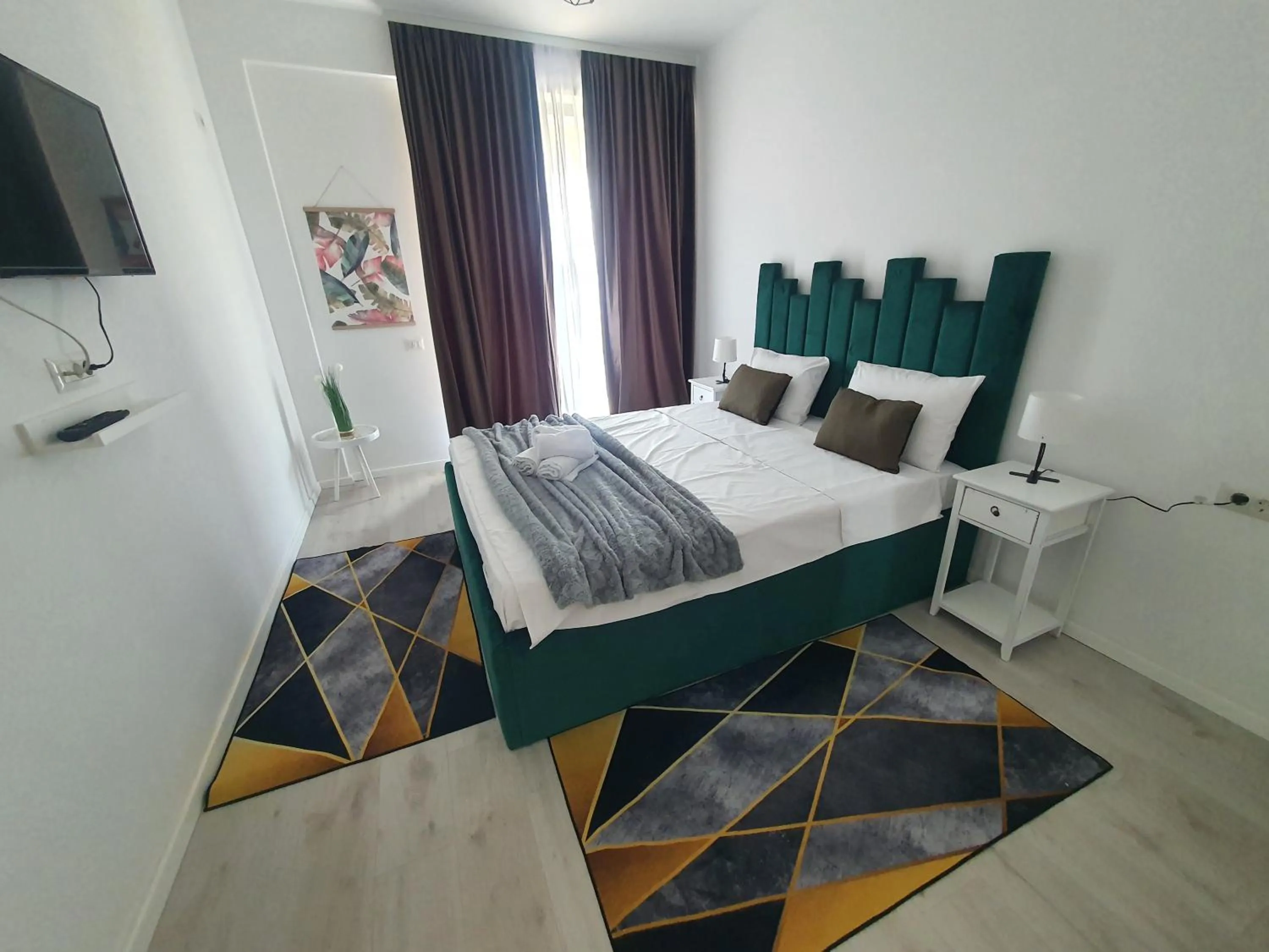 Bed in Grey Residence Apartments