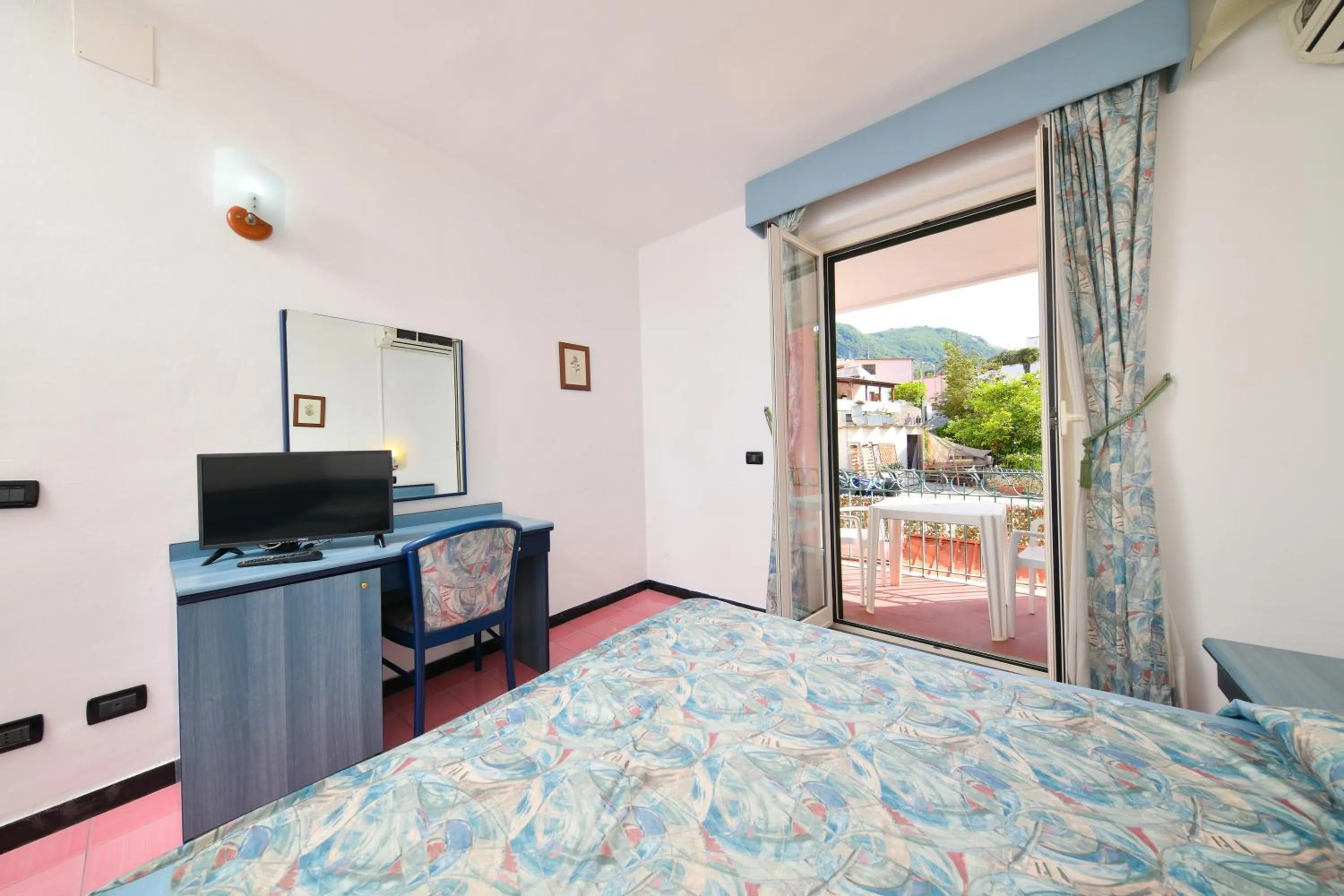 Photo of the whole room, TV/Entertainment Center in Fortuna Beach - Seaside Hotel