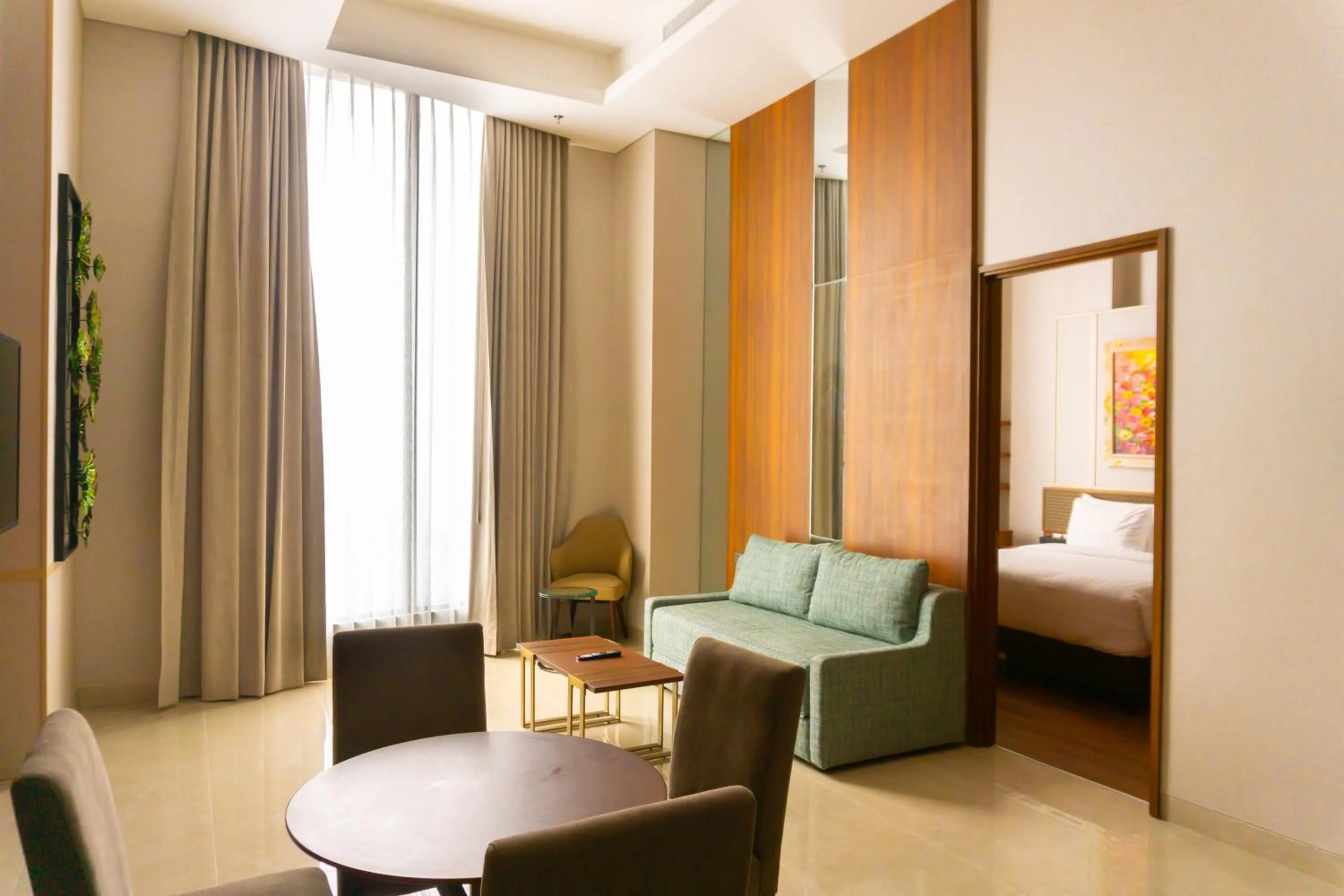 Living room, Bed in Trembesi Hotel