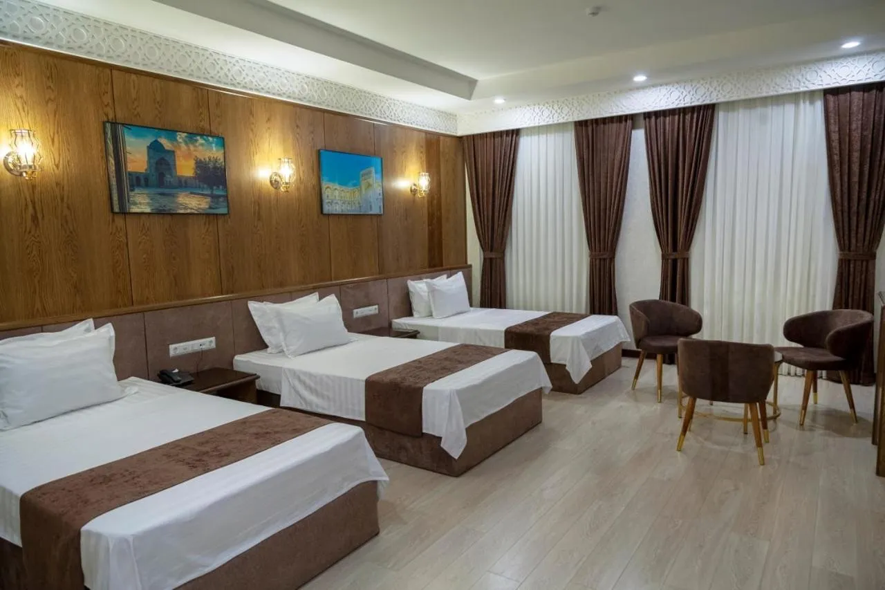 Bed in Paradise Plaza Luxury Hotel