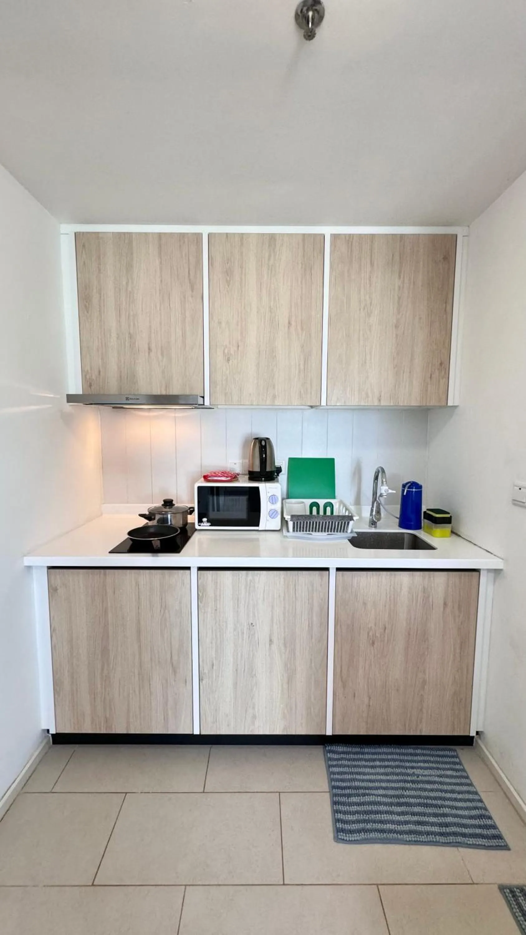 Kitchen or kitchenette in UNA Serviced Apartment by manatidur