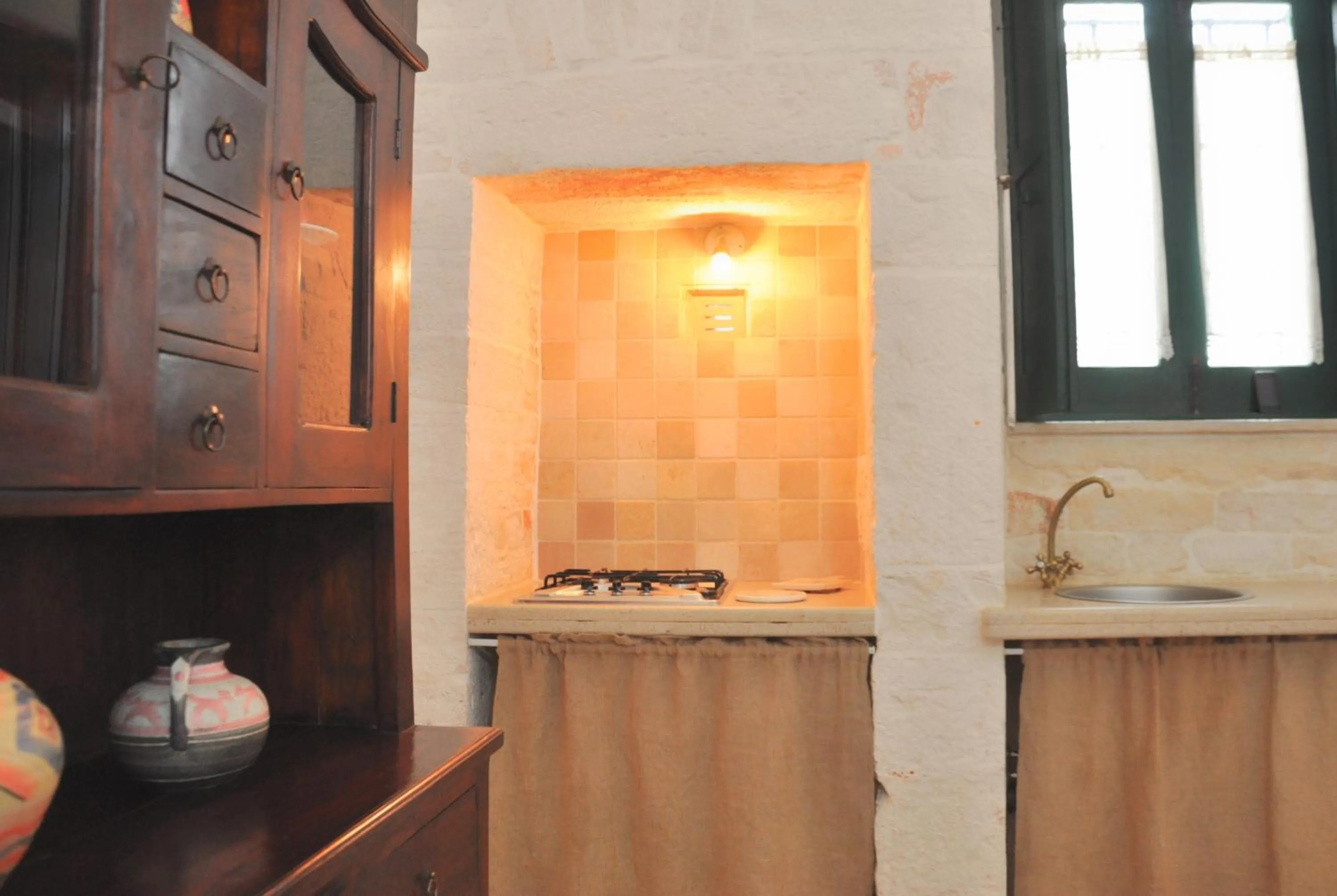 Kitchen or kitchenette in Masseria Rosa Trulli Relais