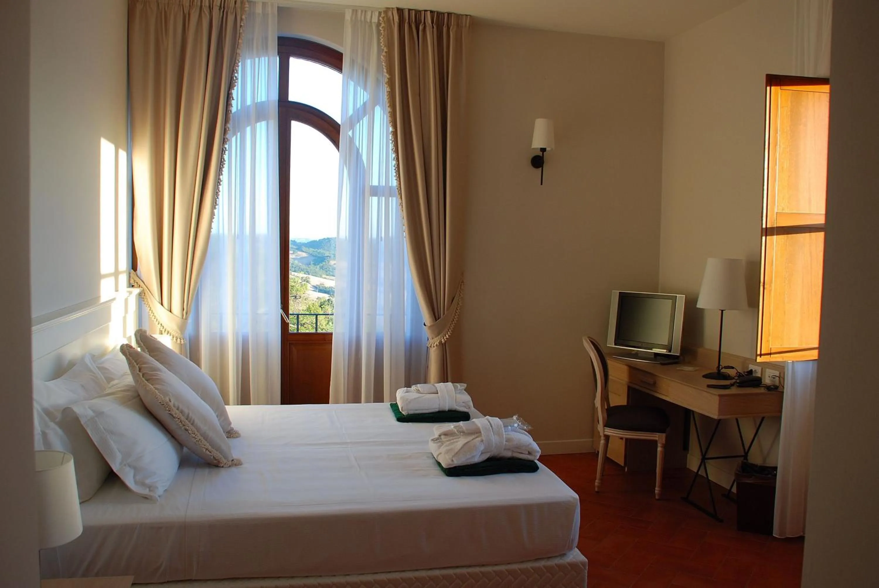 Photo of the whole room, Bed in Saturnia Tuscany Hotel