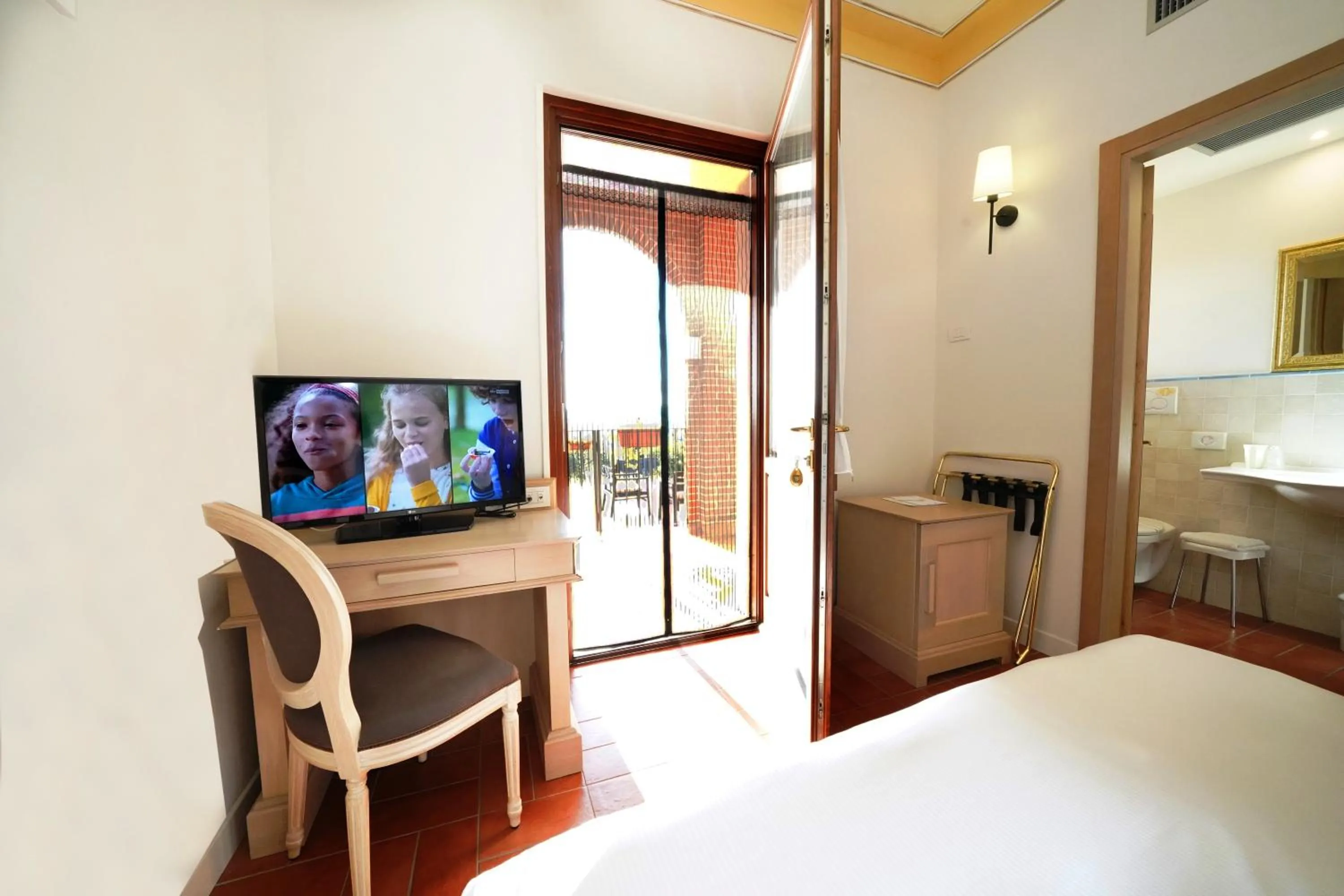 Bed in Saturnia Tuscany Hotel