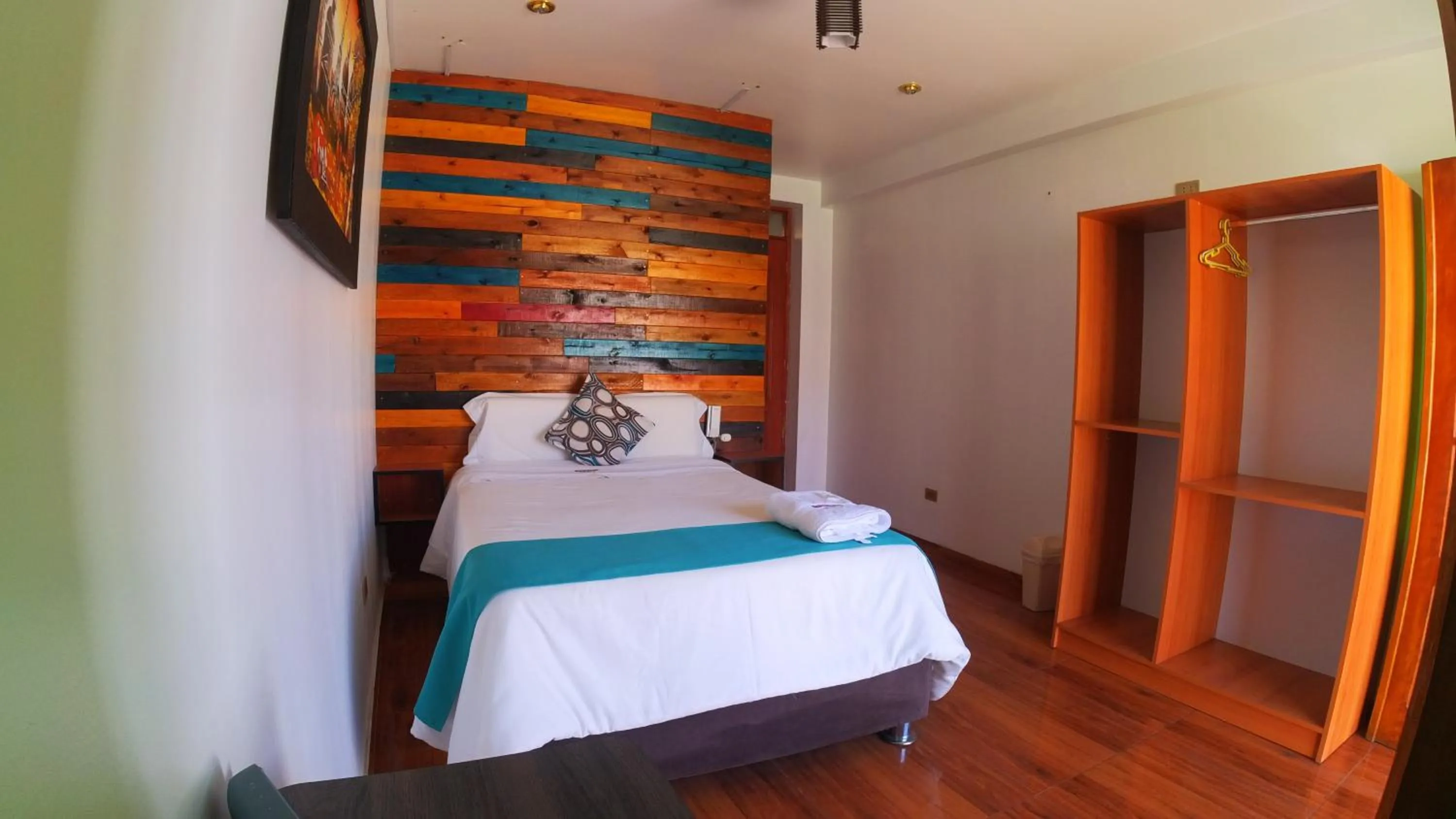 Bed in Sumaq Wari Hotel