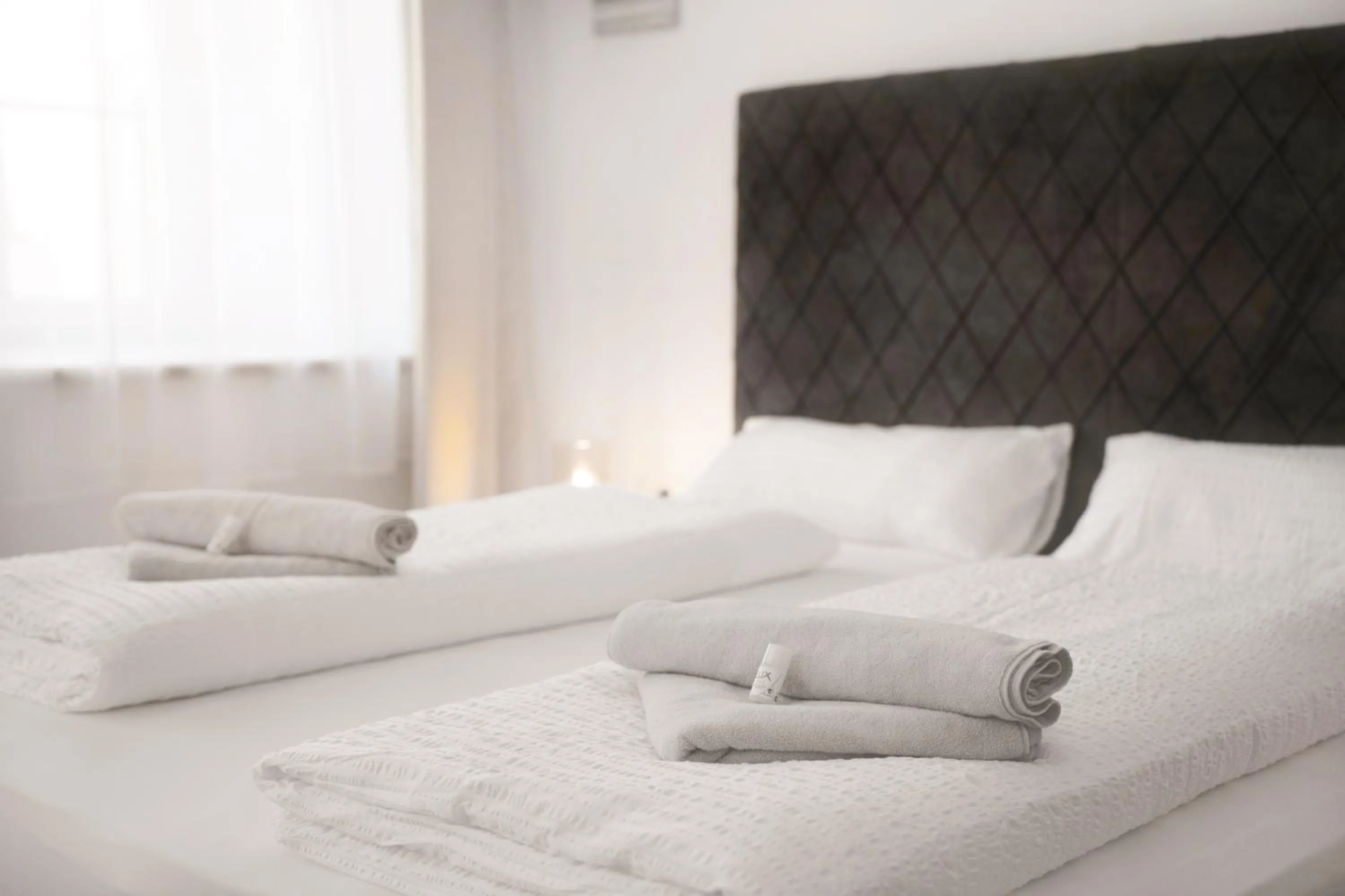 Bed in easy-flat Hauptplatz - City Center Apartments with a Kitchen