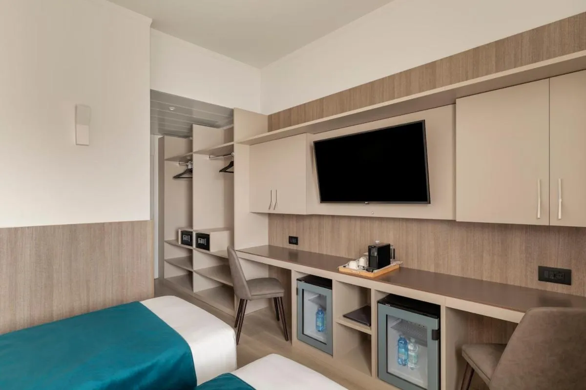 Bed in Living Hotel Milano