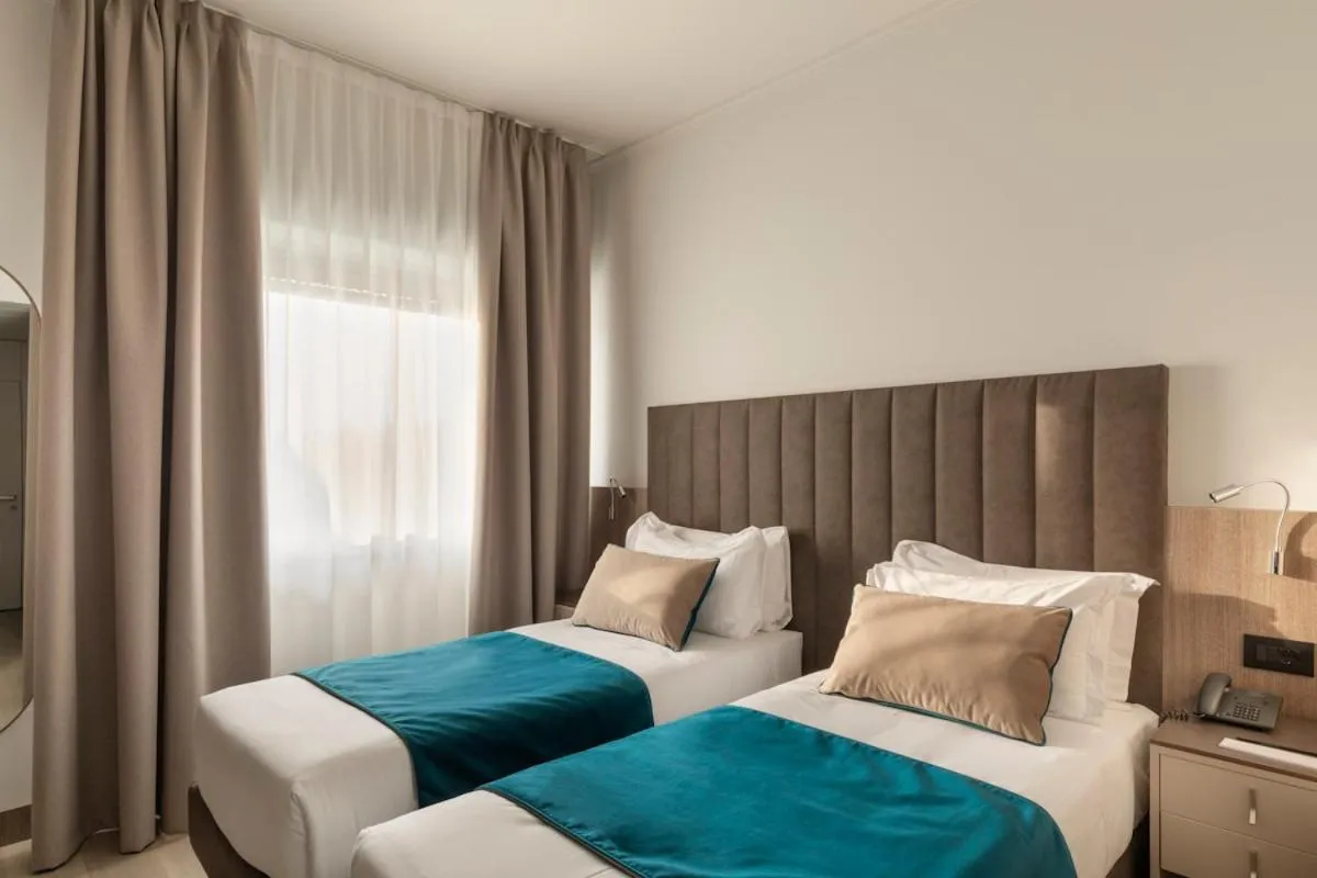 Bed in Living Hotel Milano