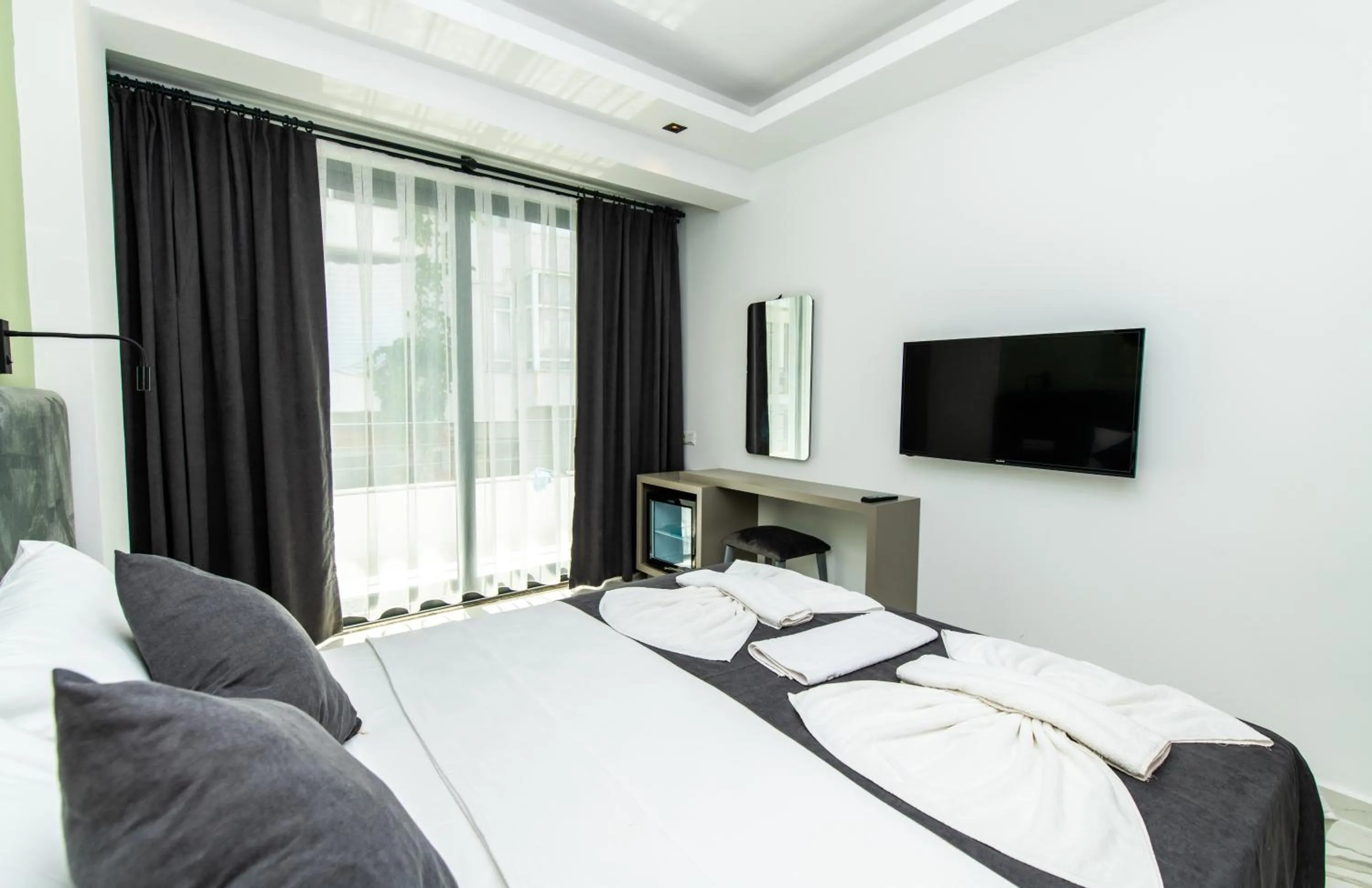 Communal lounge/ TV room in Leonis Hotel