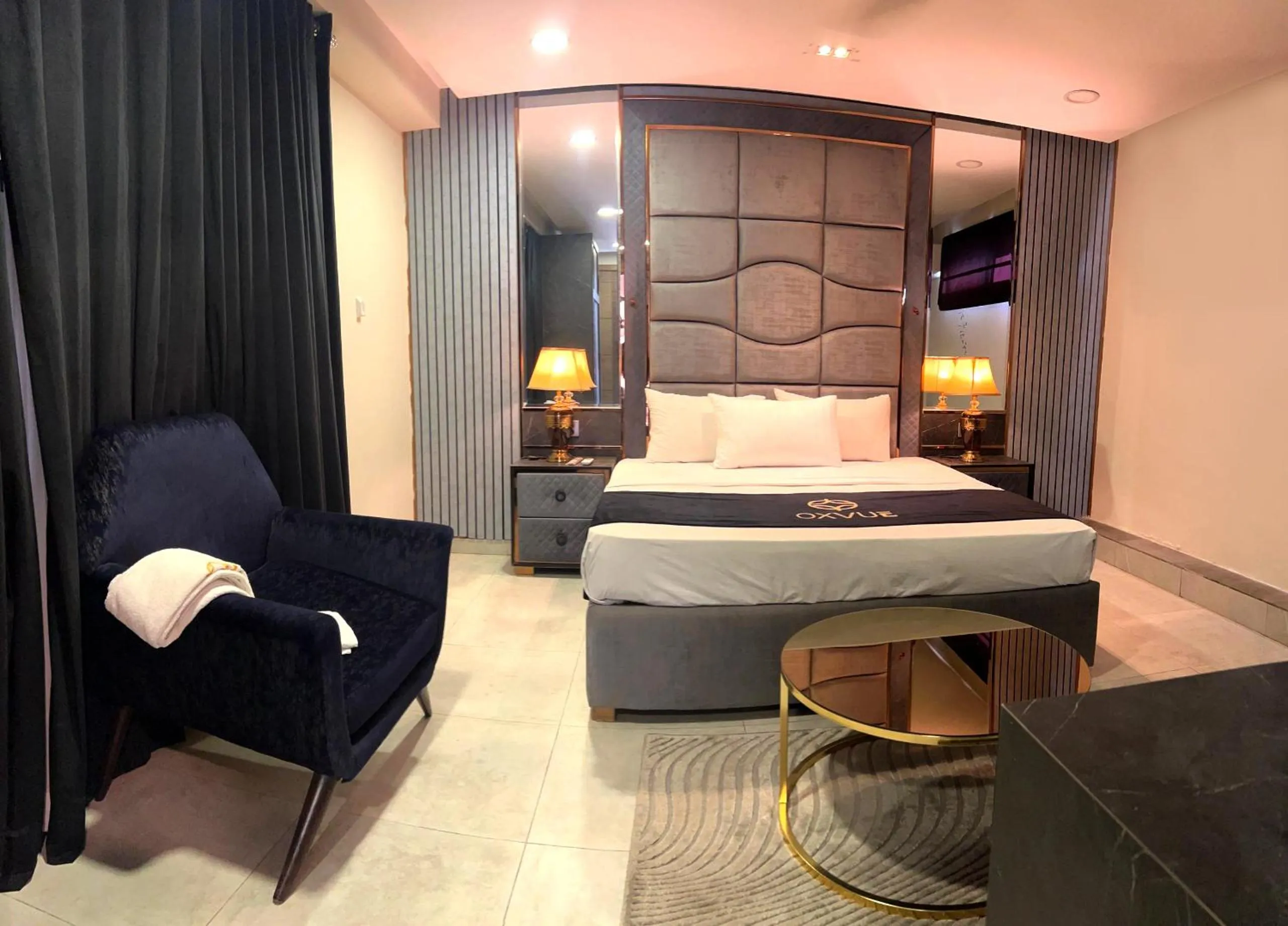 Bed in OXVUE Boutique Hotel