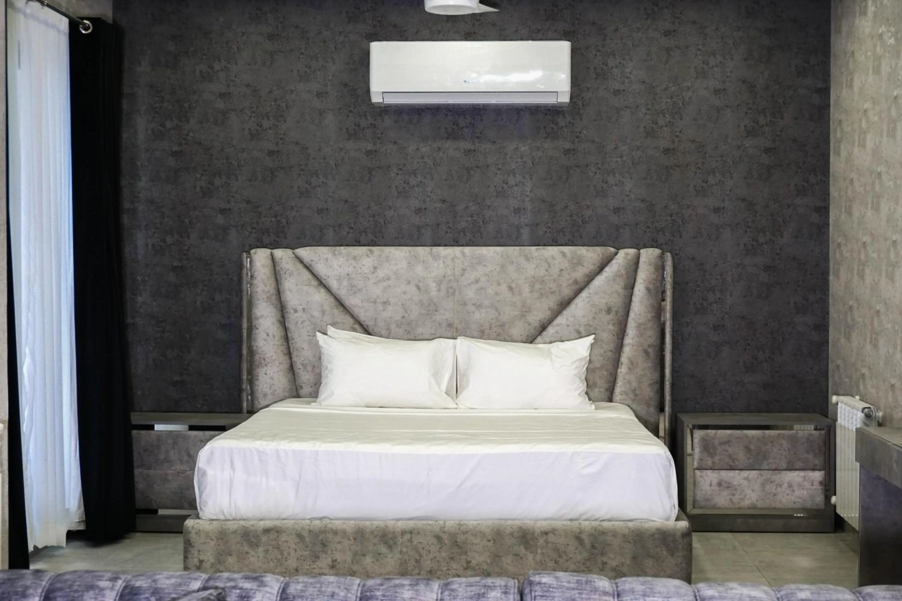 Bed in OXVUE Boutique Hotel