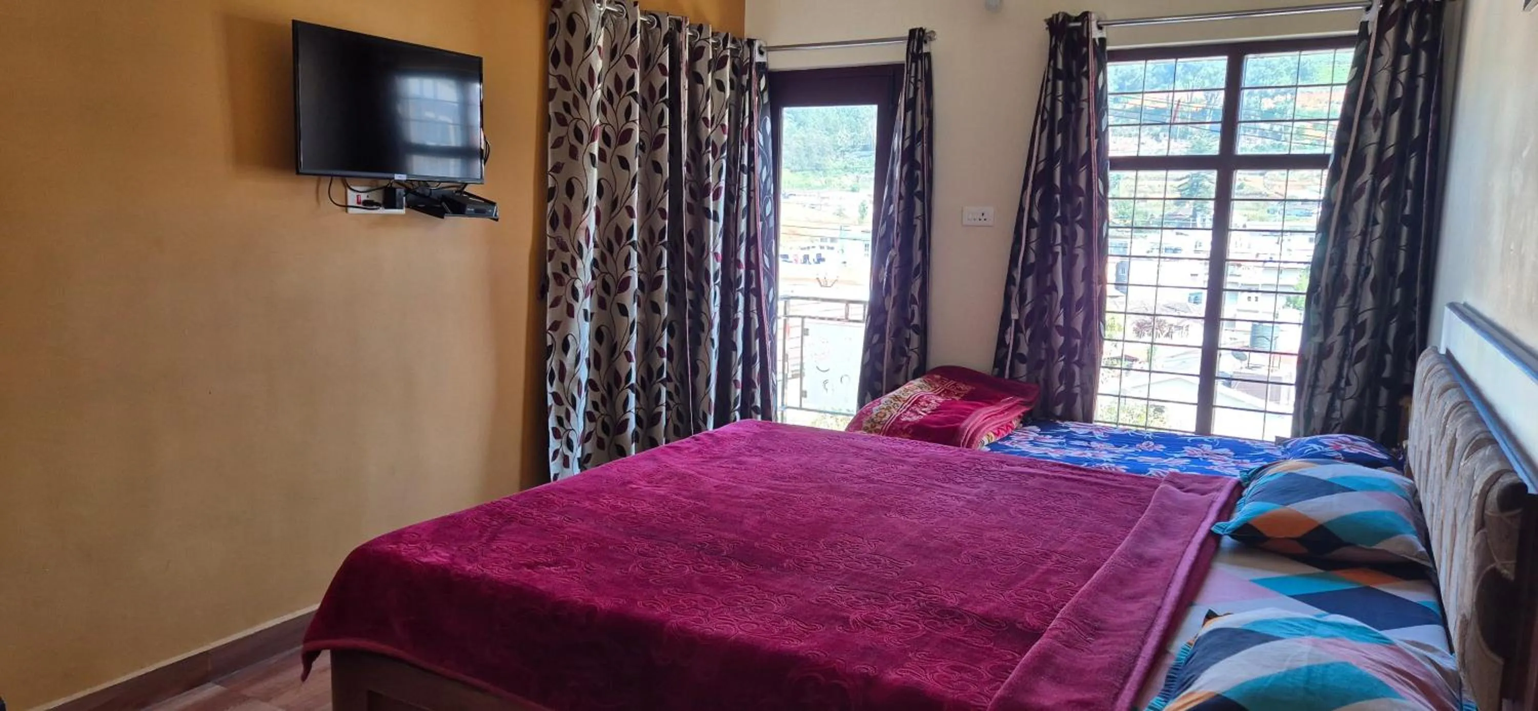 Bedroom, Bed in Karpagam Residency