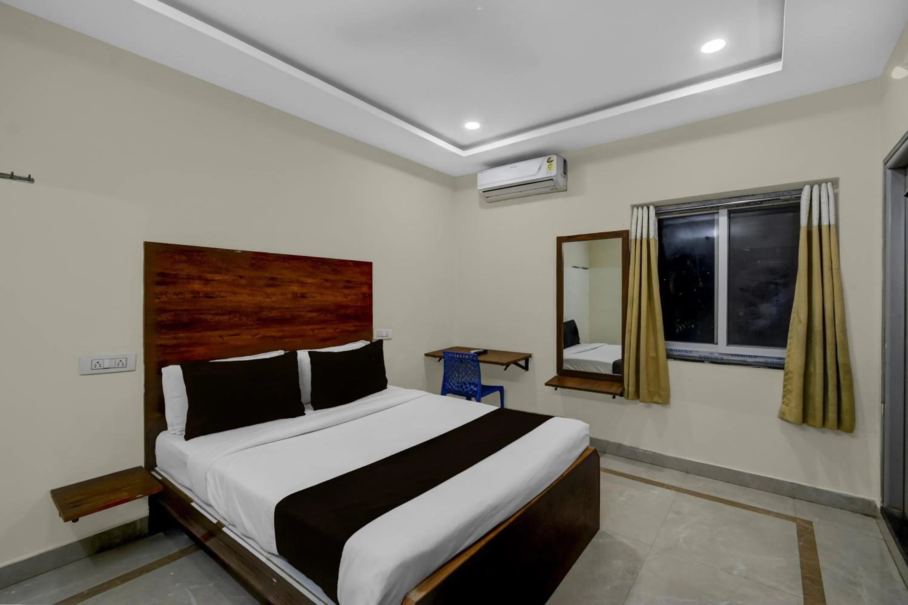 Bedroom, Bed in Townhouse Financial District Gachibowli Formerly Srinika Inn