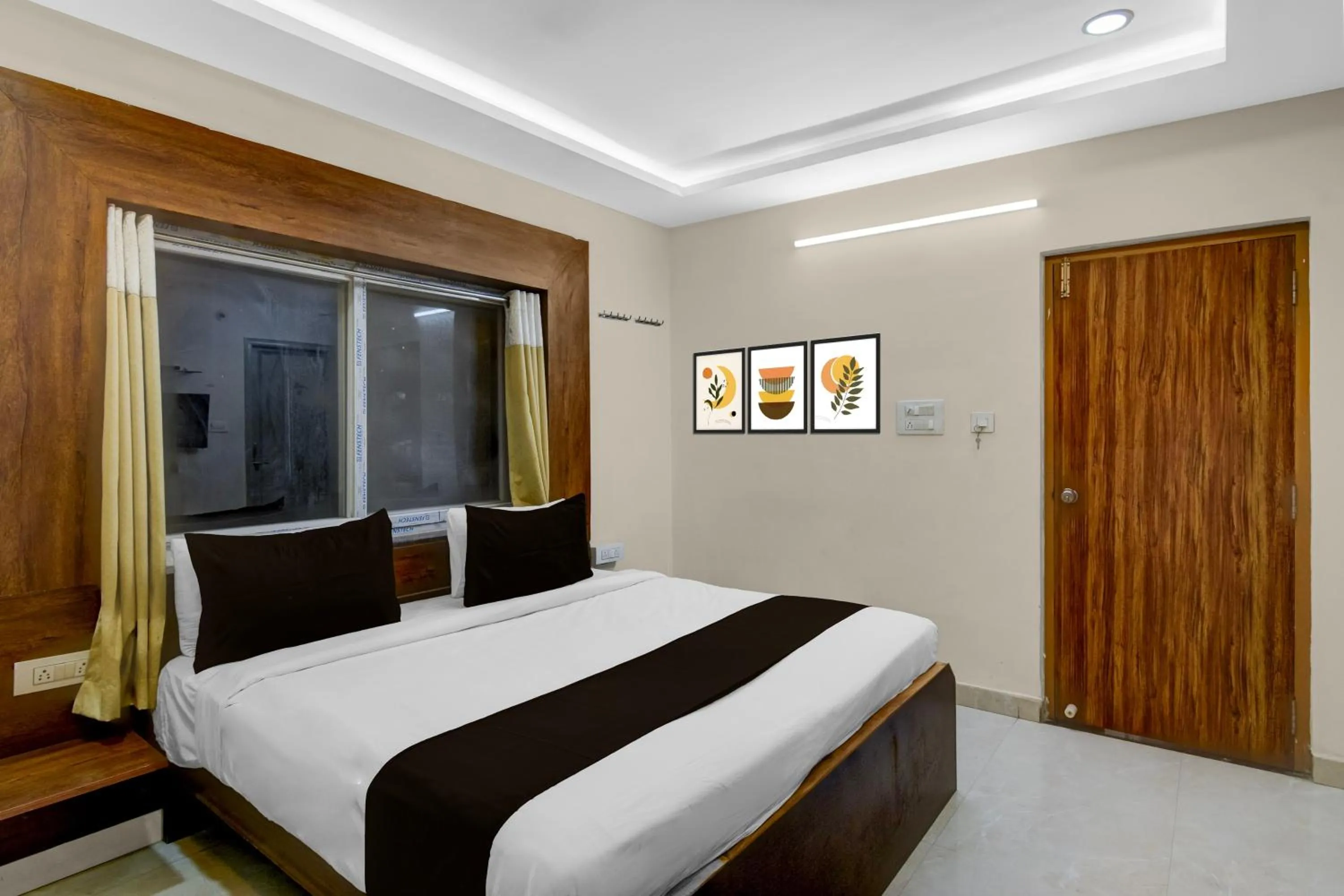 Bedroom, Bed in Super Townhouse Financial District Gachibowli Formerly Srinika Inn