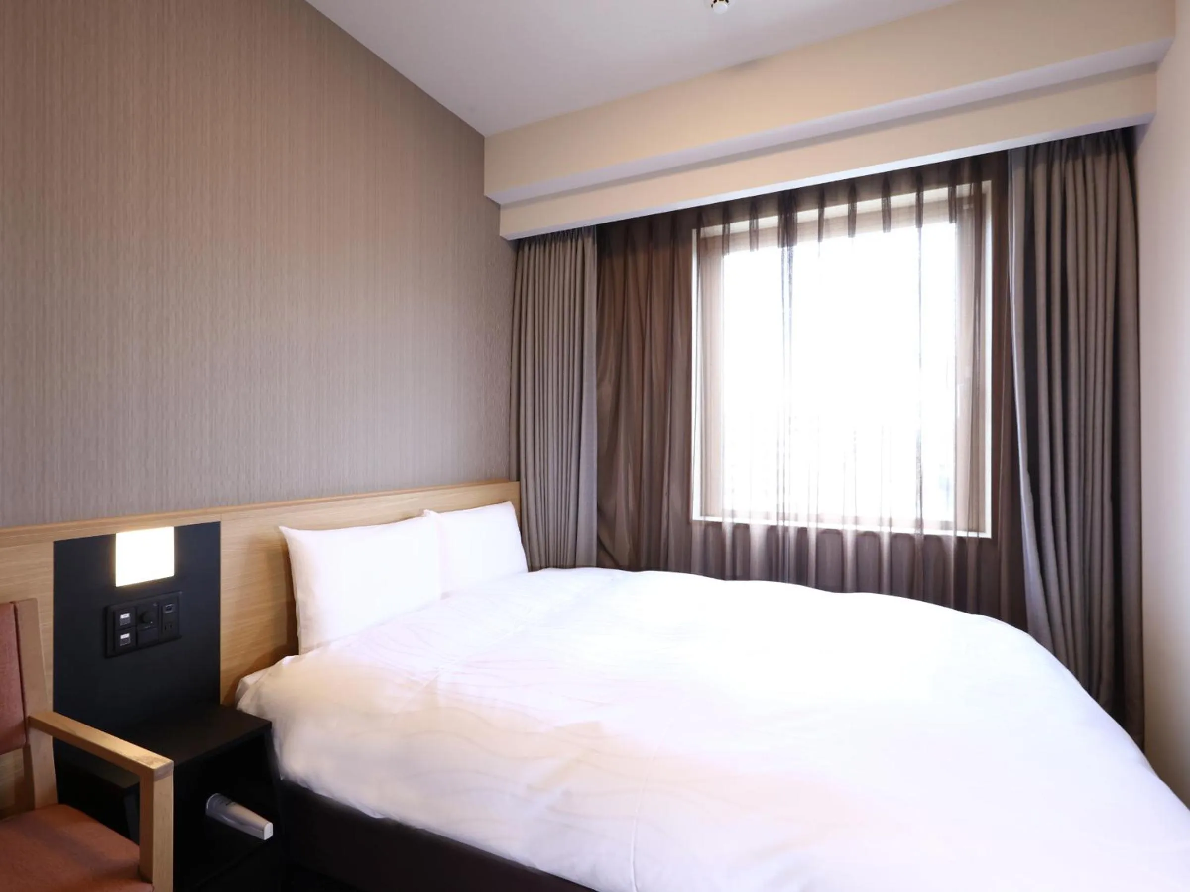 Bed in Dormy Inn Okayama Natural Hot Spring