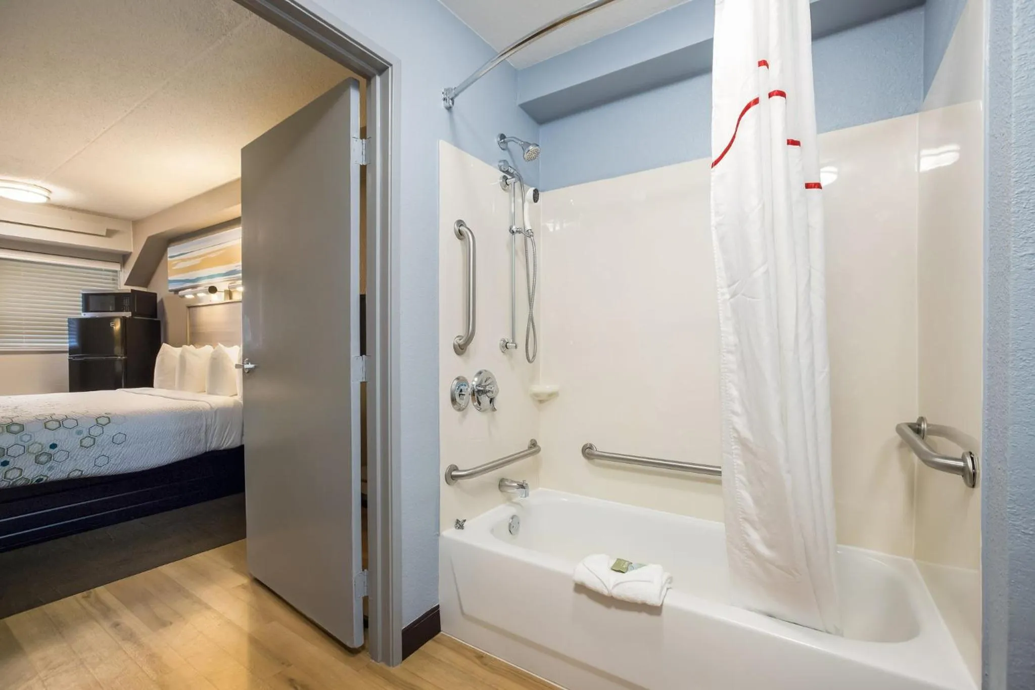 Bathroom, Bed in HomeTowne Studios by Red Roof Princeton - Ewing/ Lawrenceville