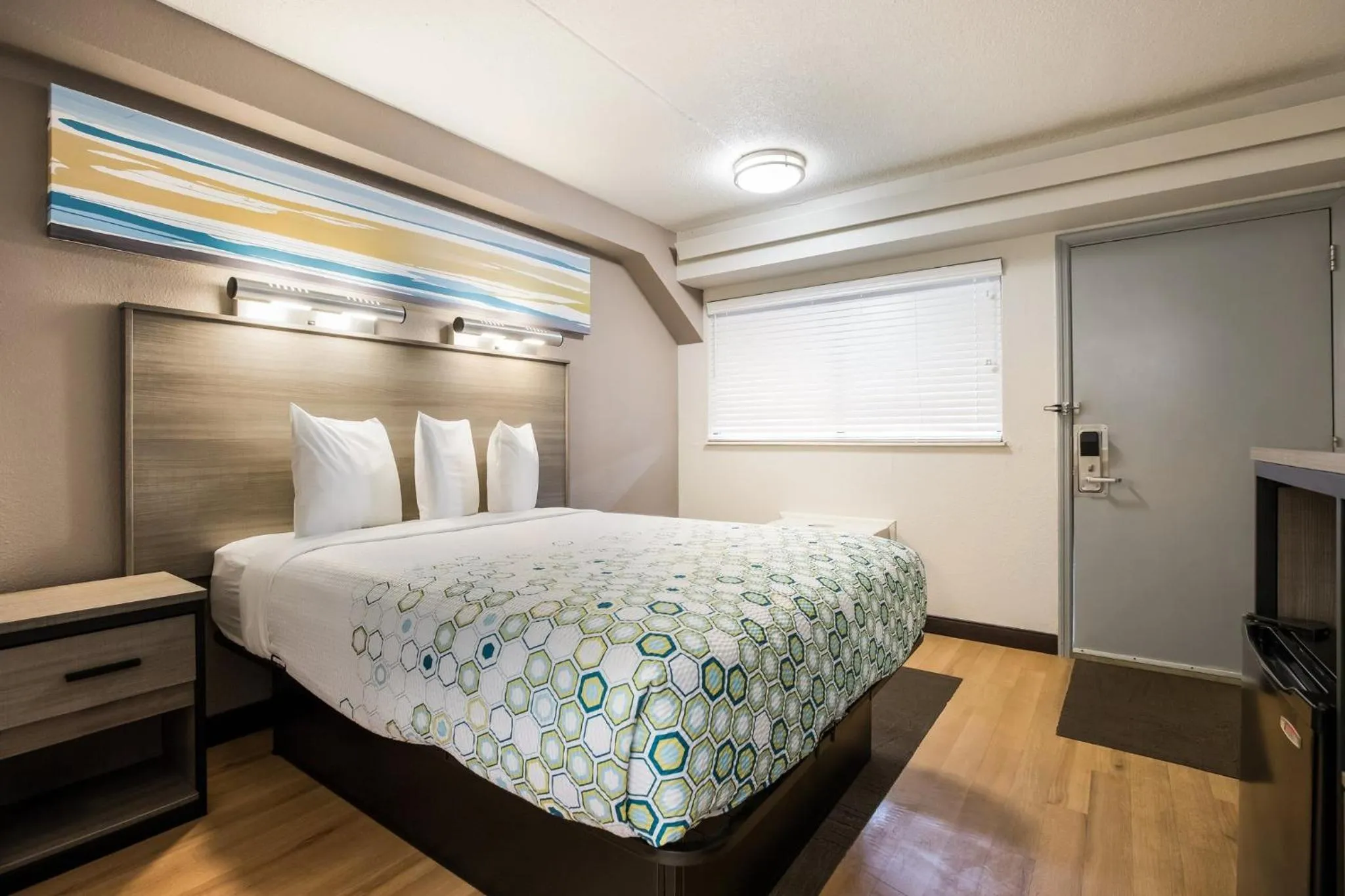 Bedroom, Bed in HomeTowne Studios by Red Roof Princeton - Ewing/ Lawrenceville