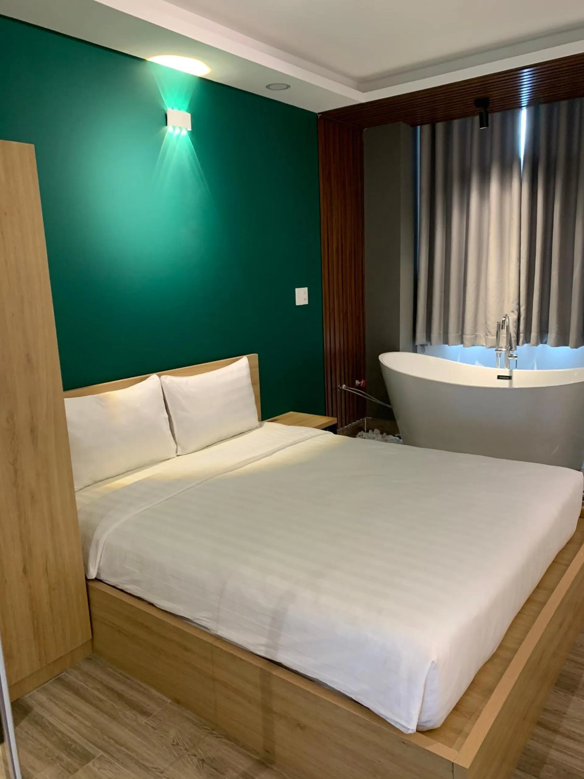 Bed in LÁ HOTEL RIVERSIDE