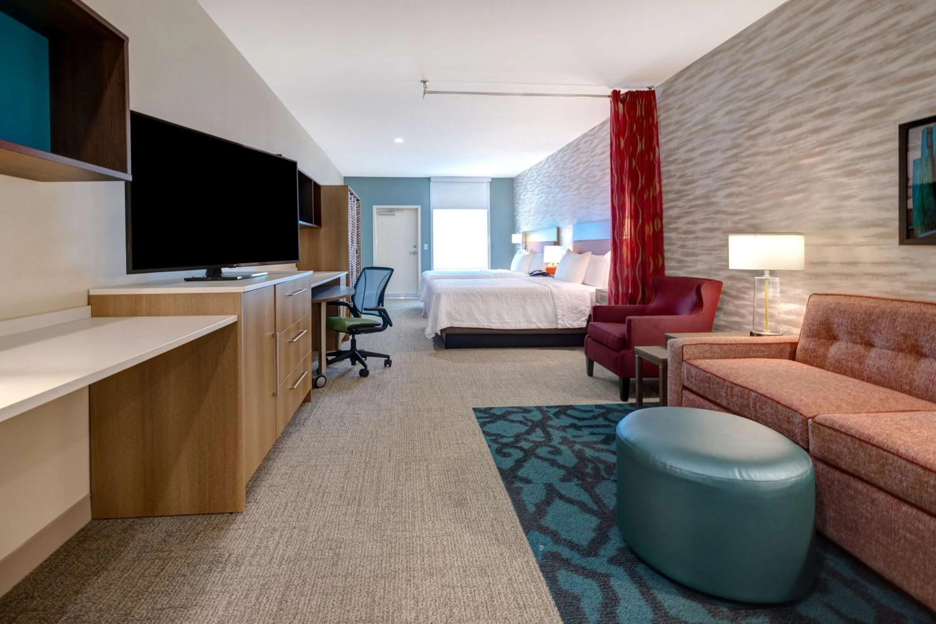 Living room, Bed in Home2 Suites Galveston, Tx