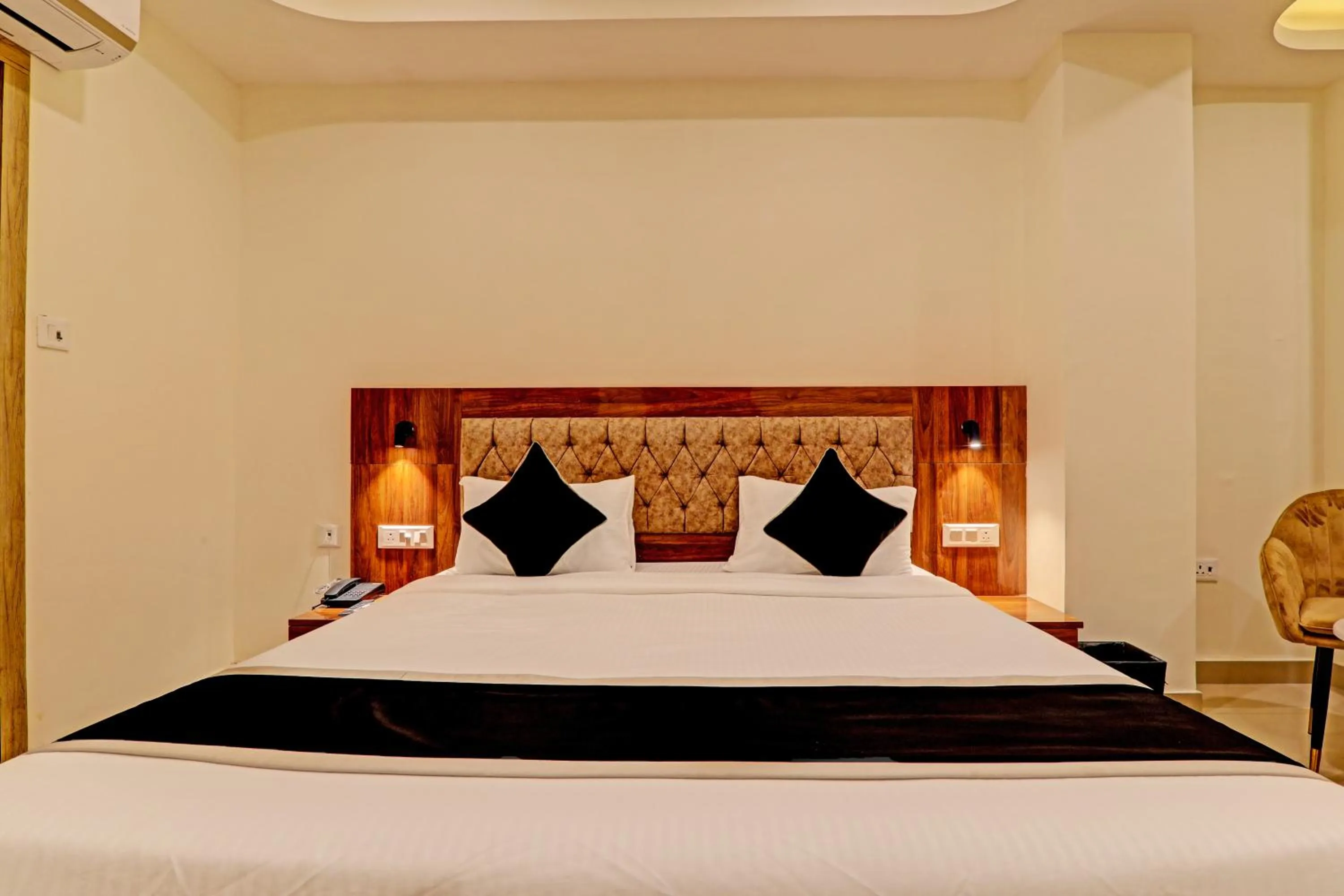 Bed in Hotel Heera Grand
