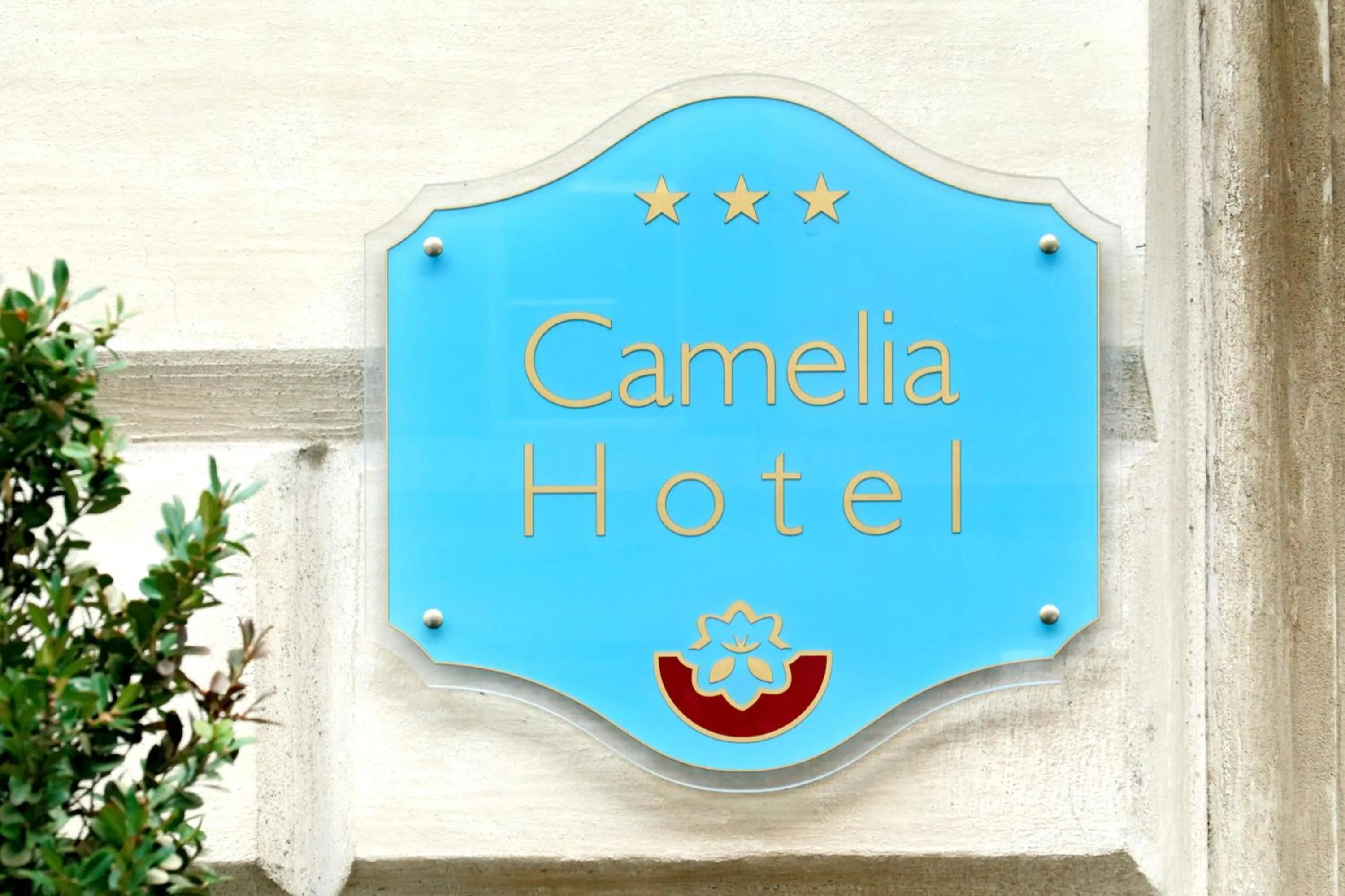 Property logo or sign in Hotel Camelia