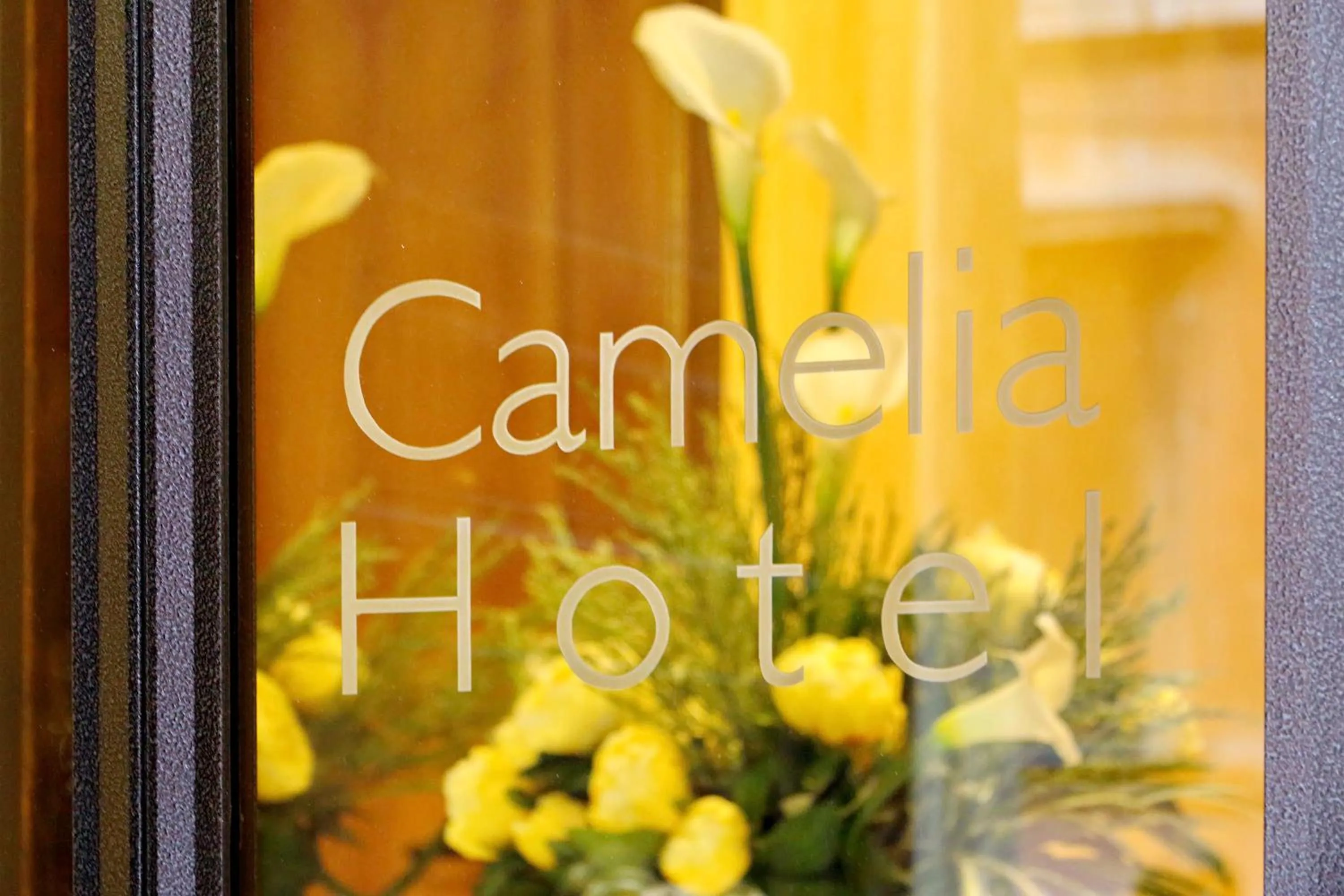 Property logo or sign in Hotel Camelia