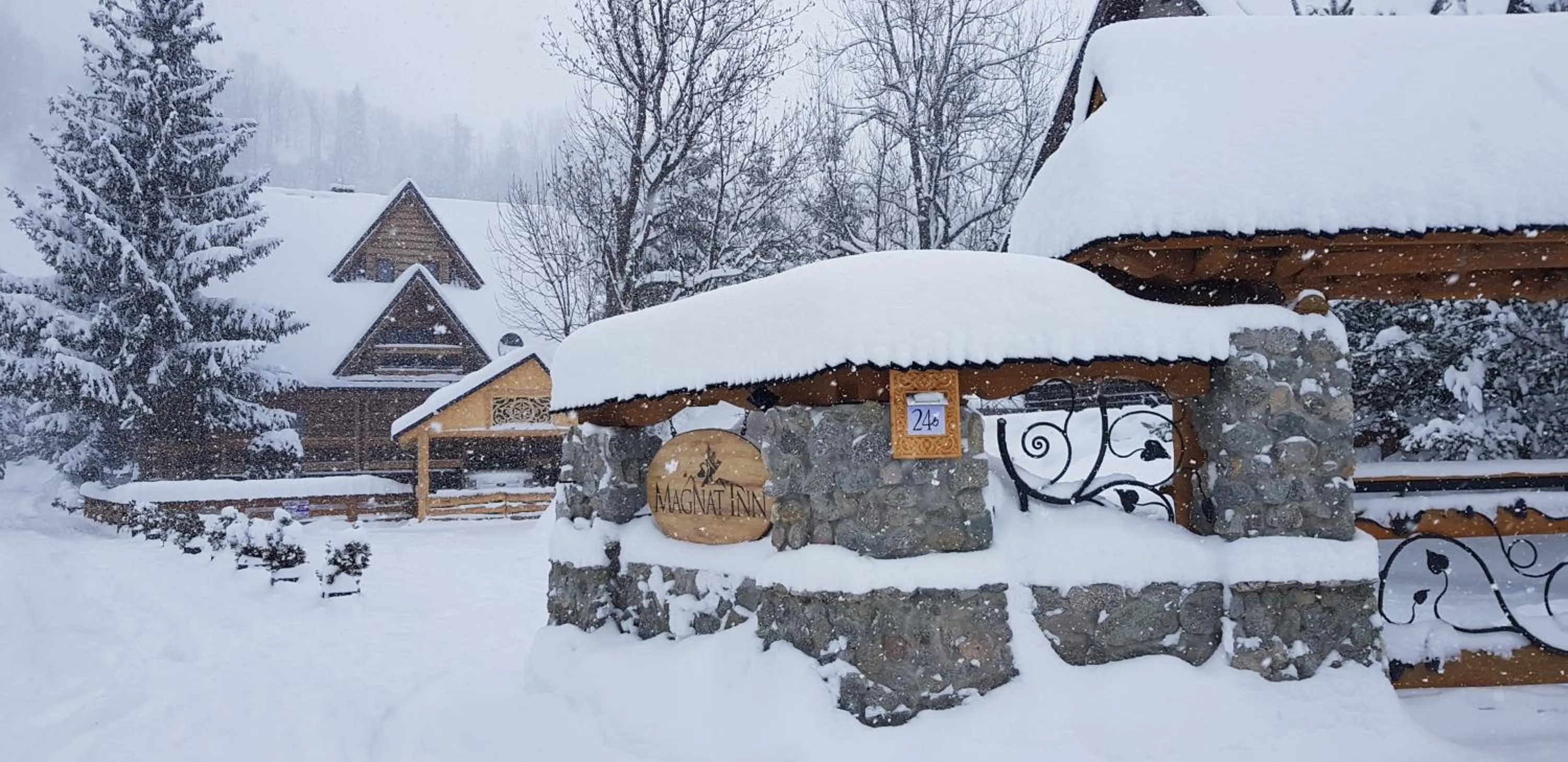 Property logo or sign in Magnat Inn Sauna & Relax