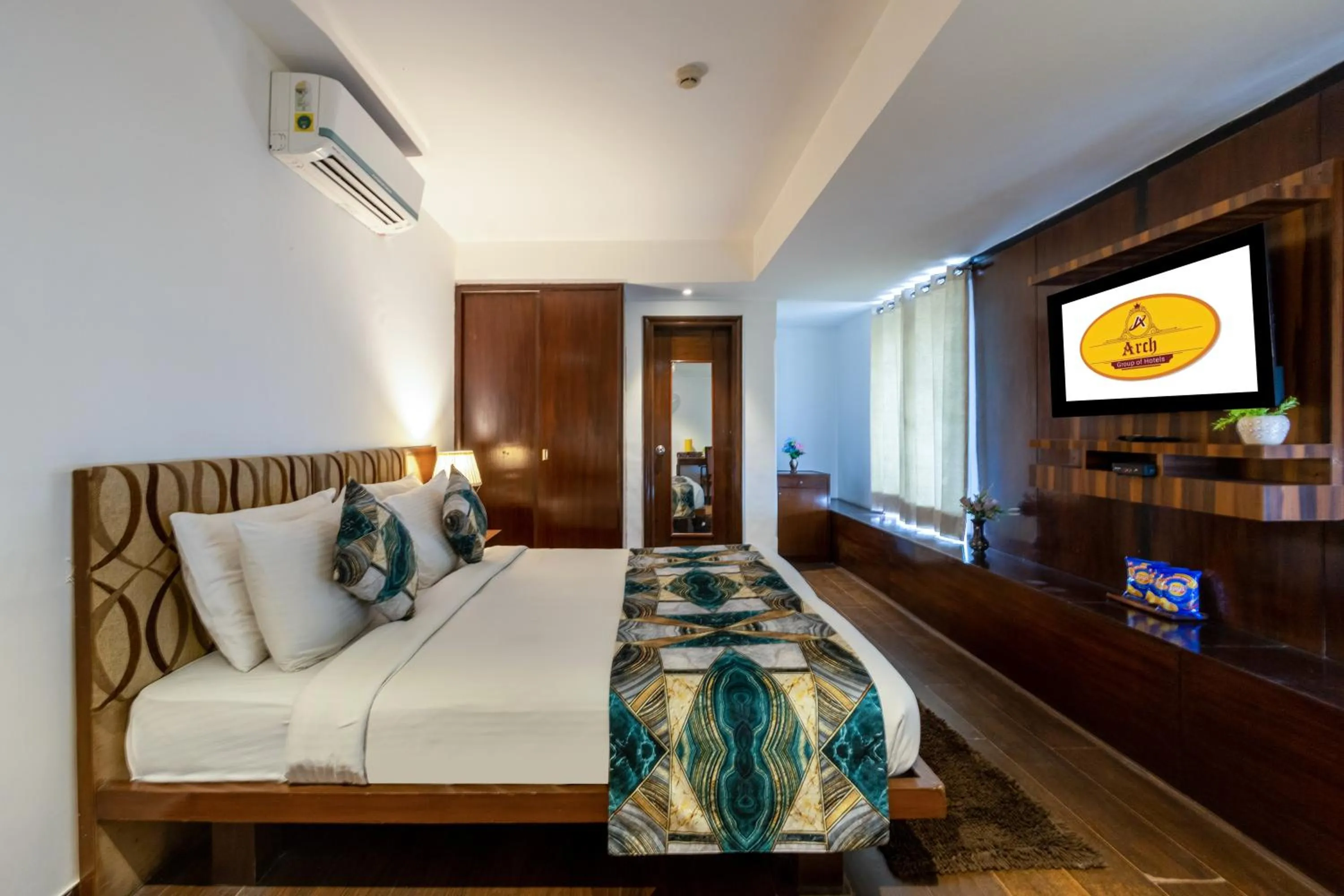 Bed in Hotel Arch Plaza at Yashobhoomi By Arch Group