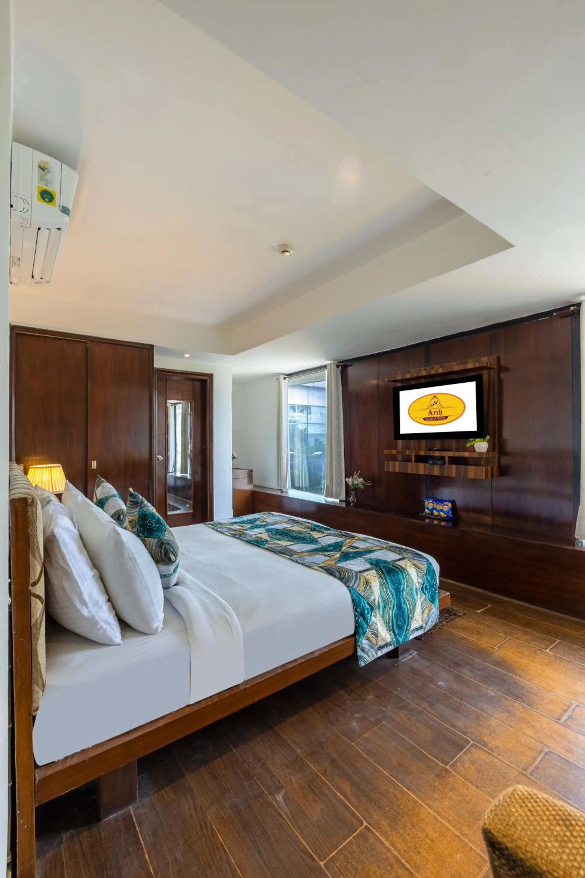 Bed in Hotel Arch Plaza at Yashobhoomi By Arch Group