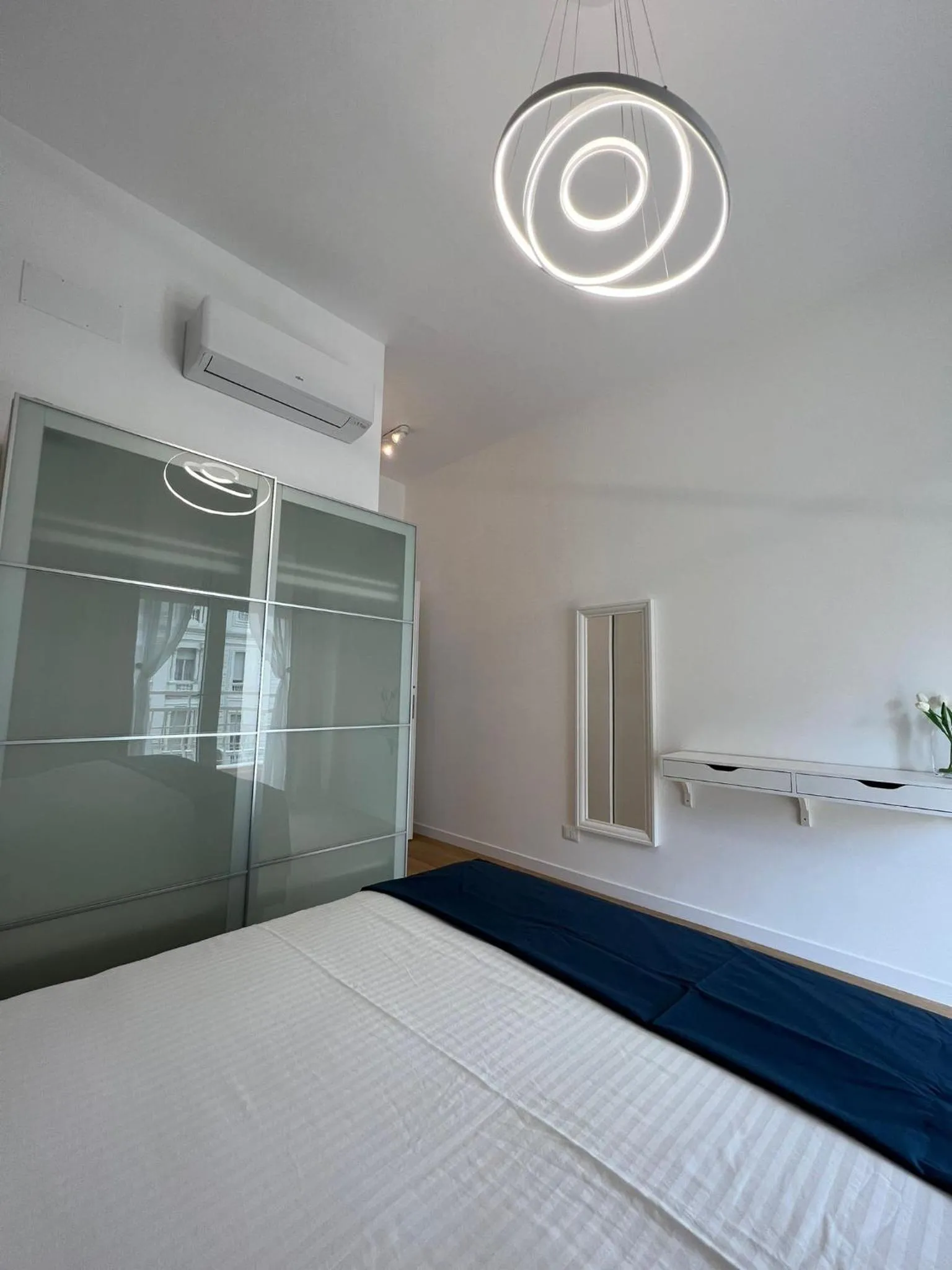 Bed in Blu Apartment