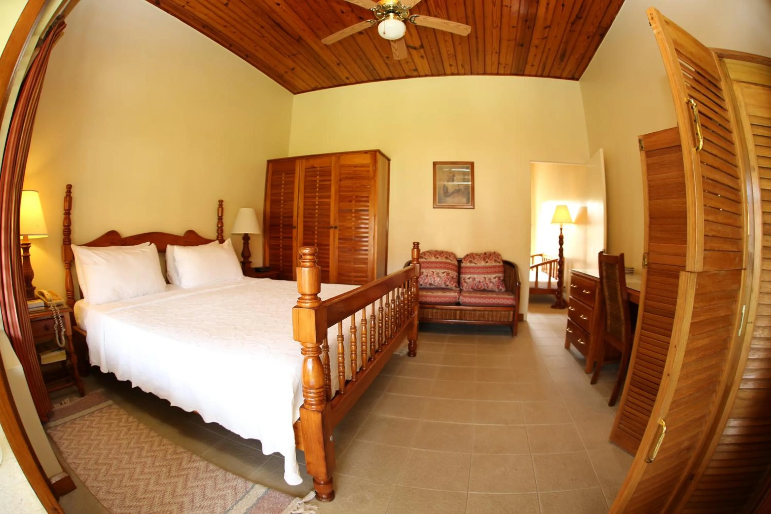 Bed in Charela Inn