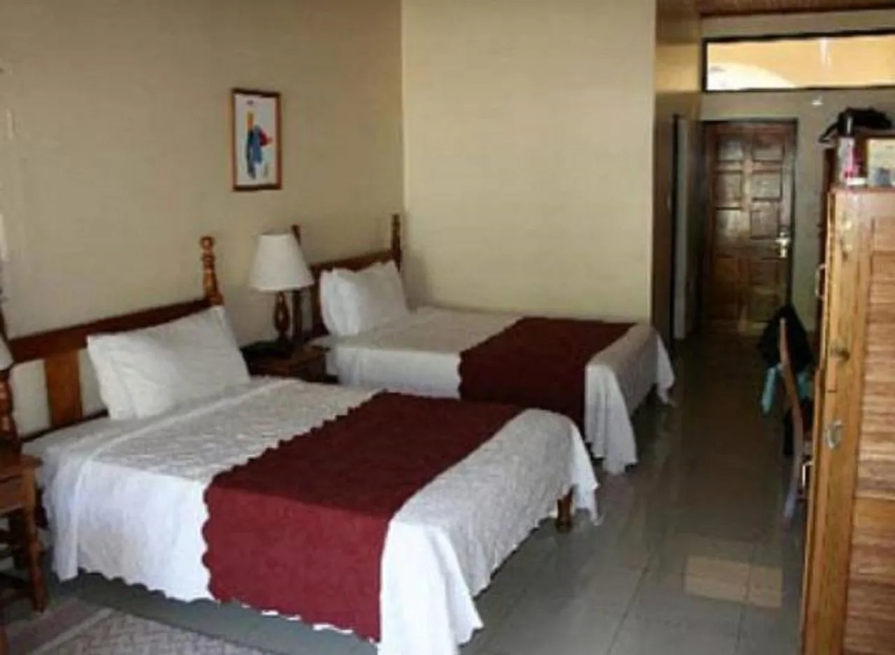 Bed in Charela Inn
