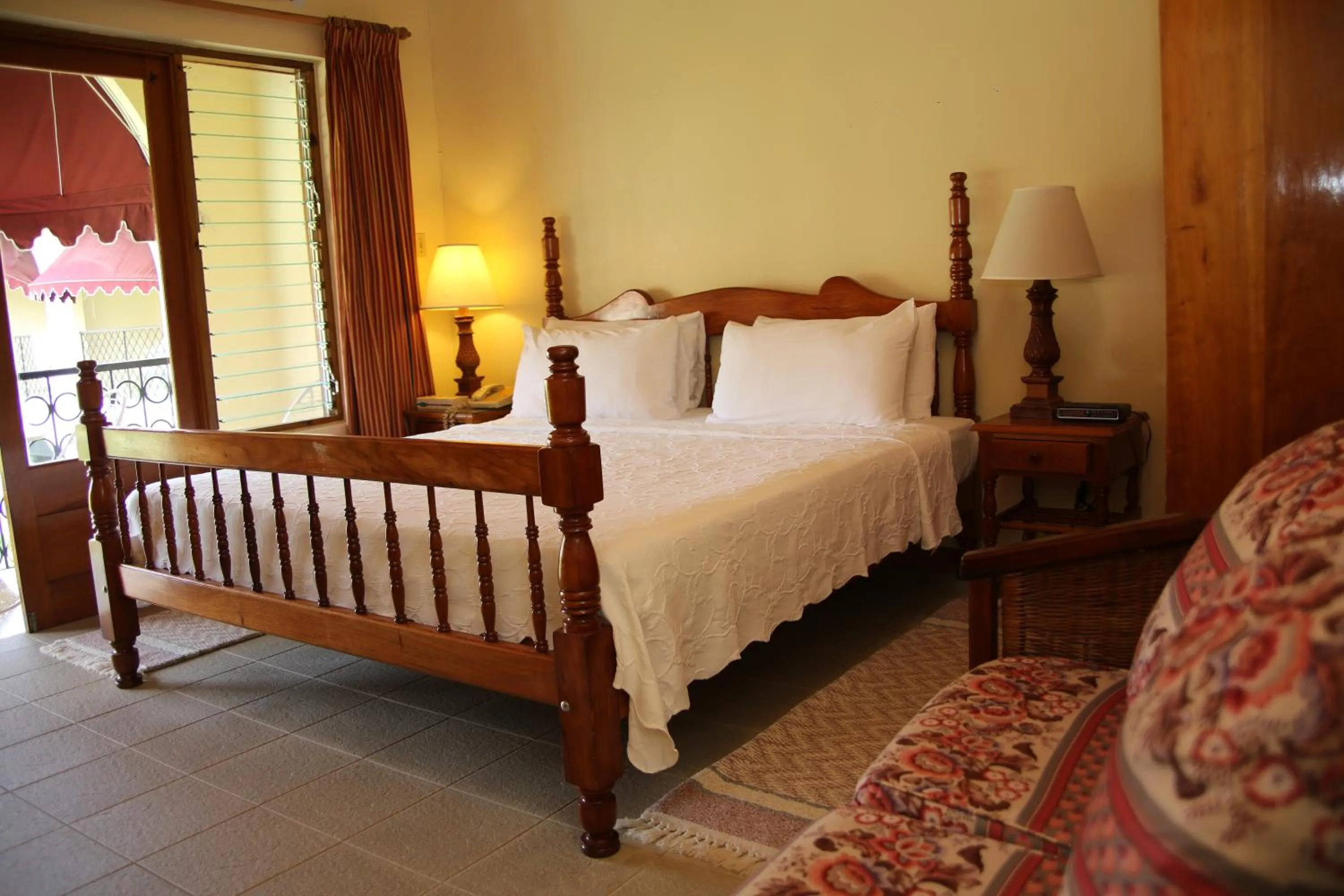 Bed in Charela Inn