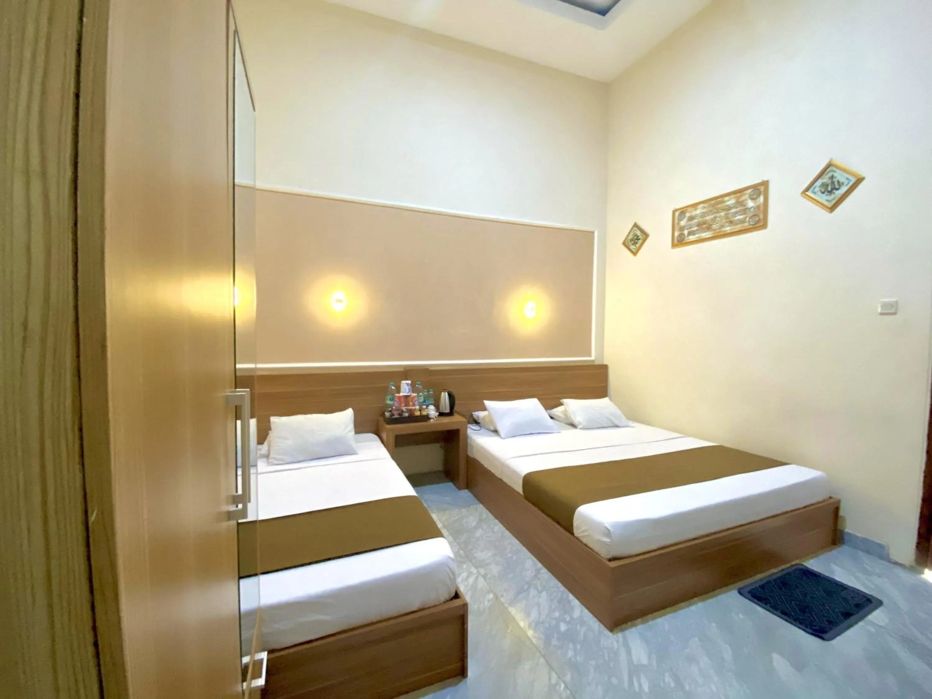 Bed in Al-Kiswah Syariah Guest House