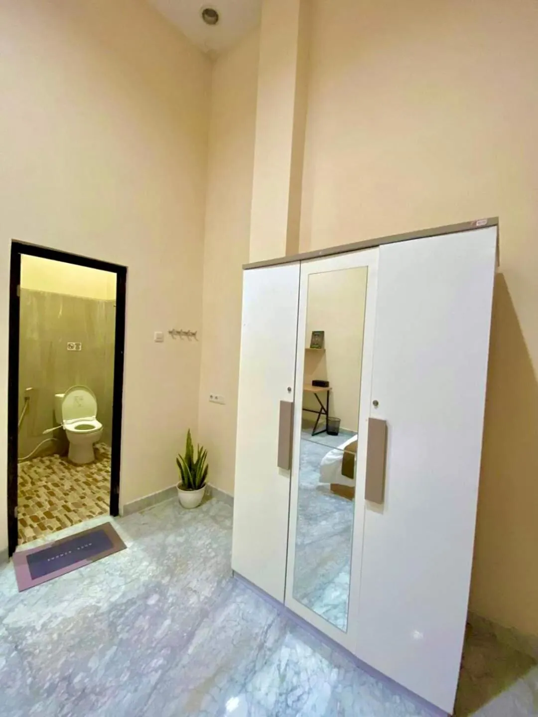 Bed in Al-Kiswah Syariah Guest House