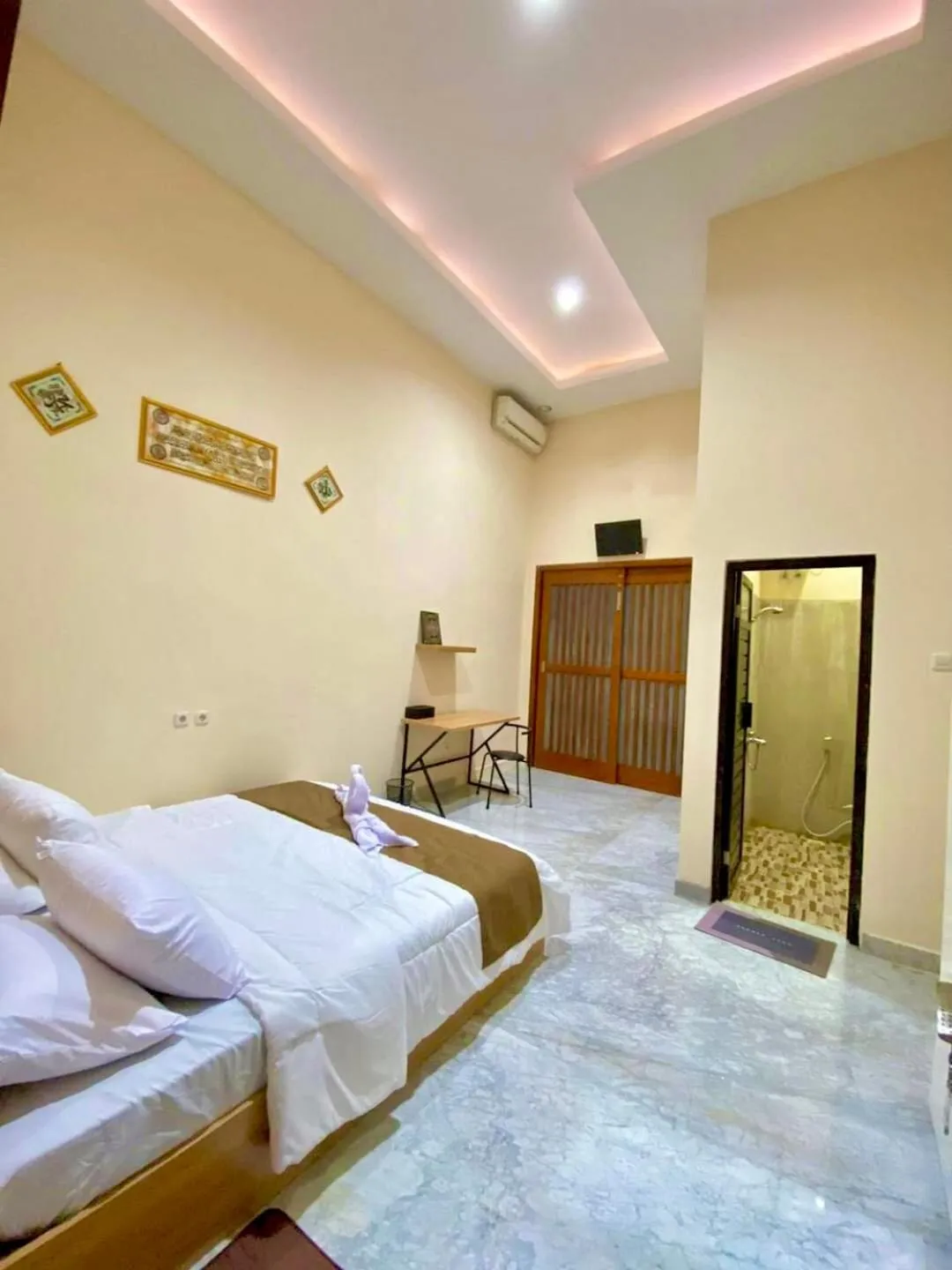 Bed in Al-Kiswah Syariah Guest House