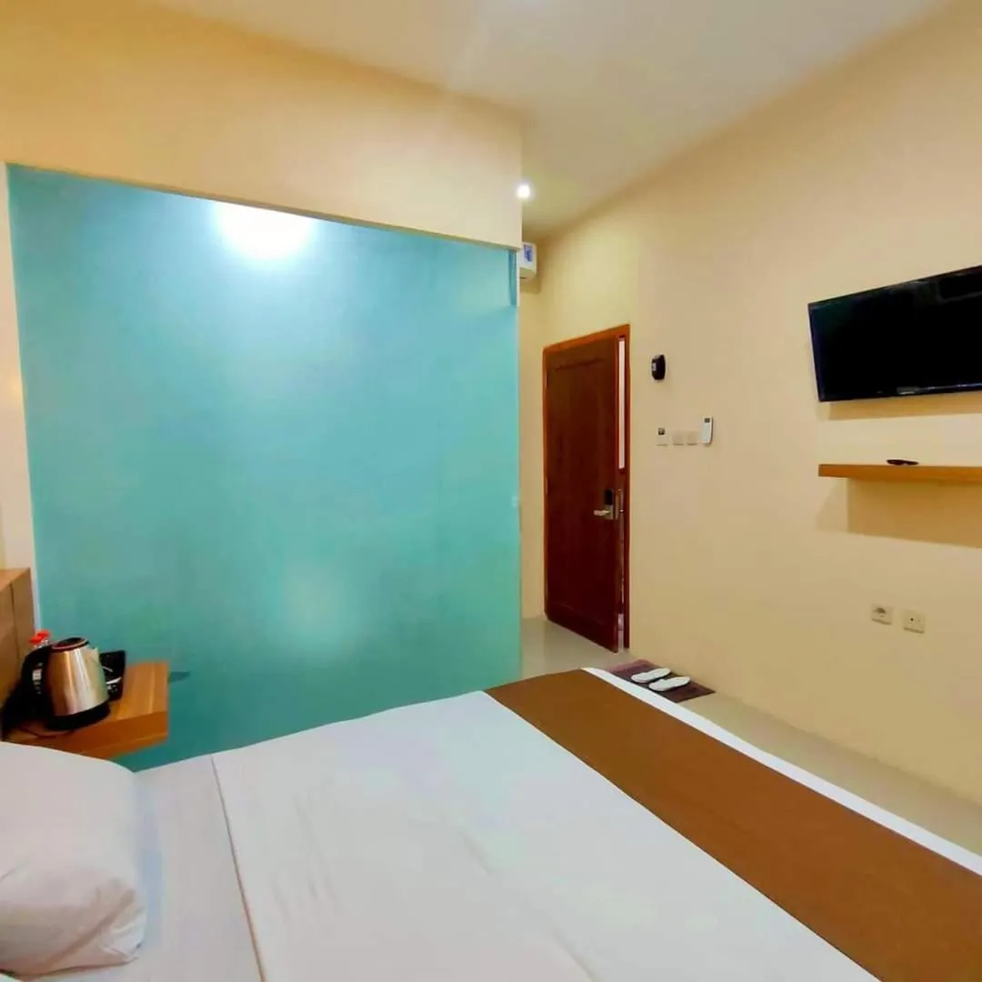 Bed in Al-Kiswah Syariah Guest House