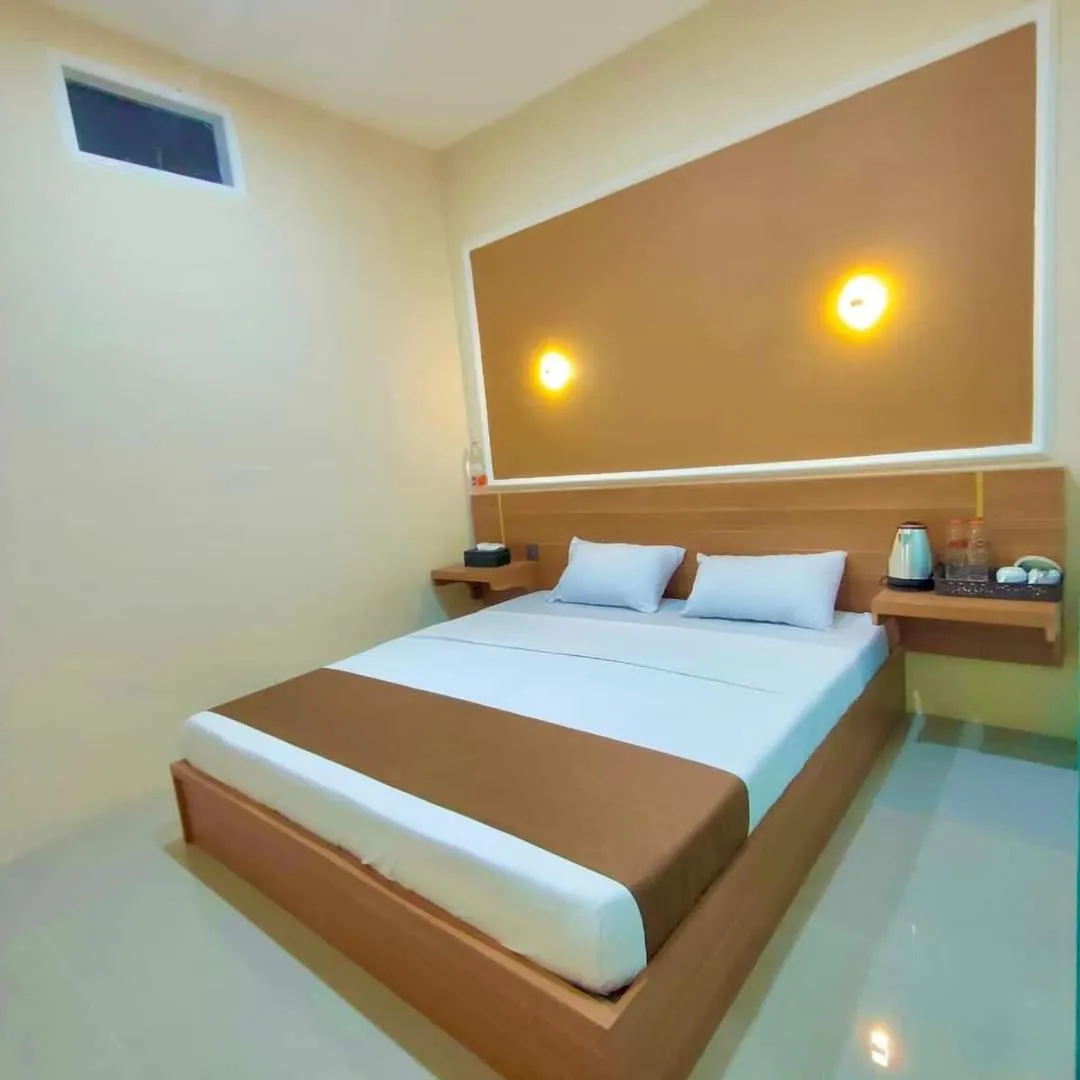 Bed in Al-Kiswah Syariah Guest House
