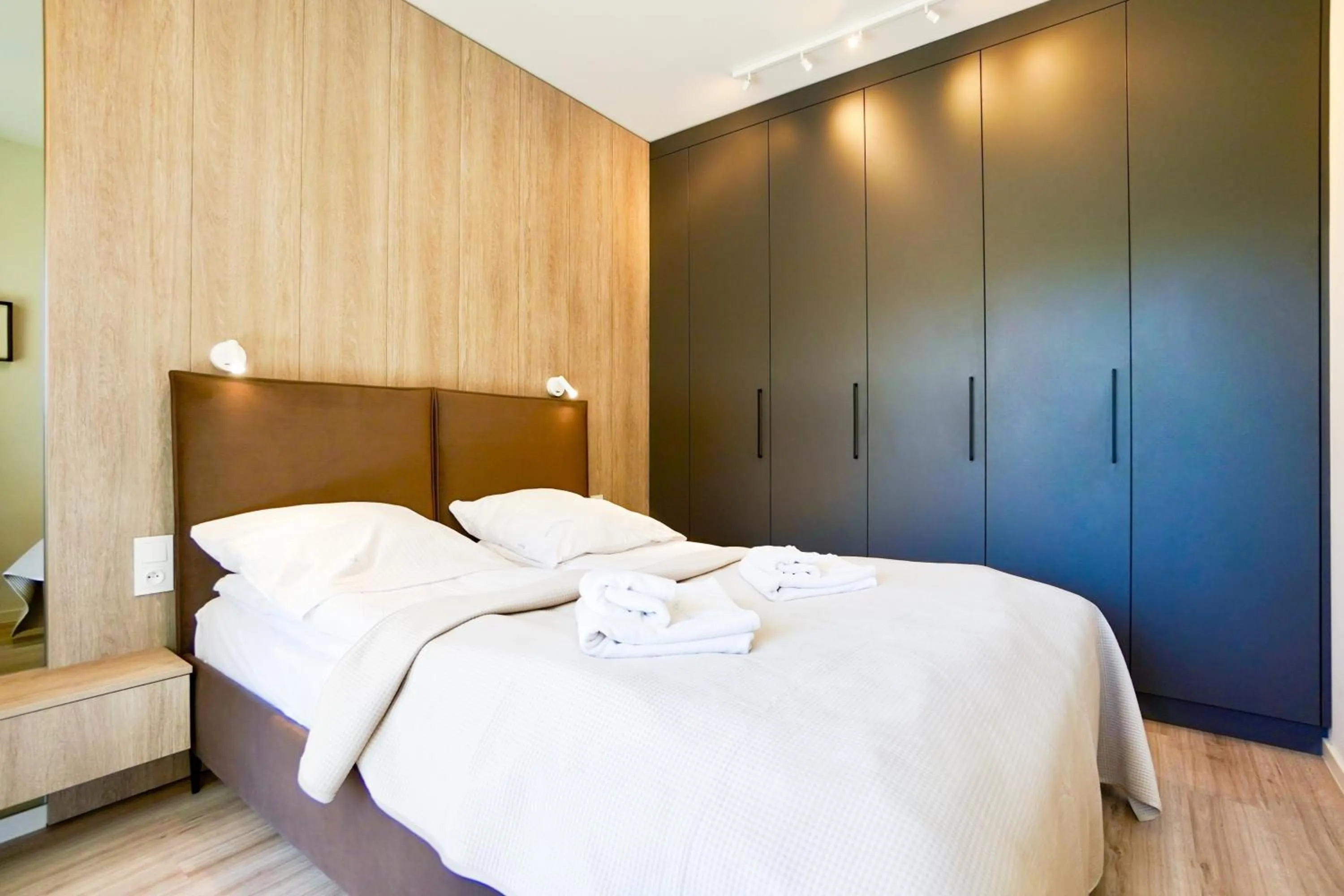 Bed in Timber Apartments by Baltic Home