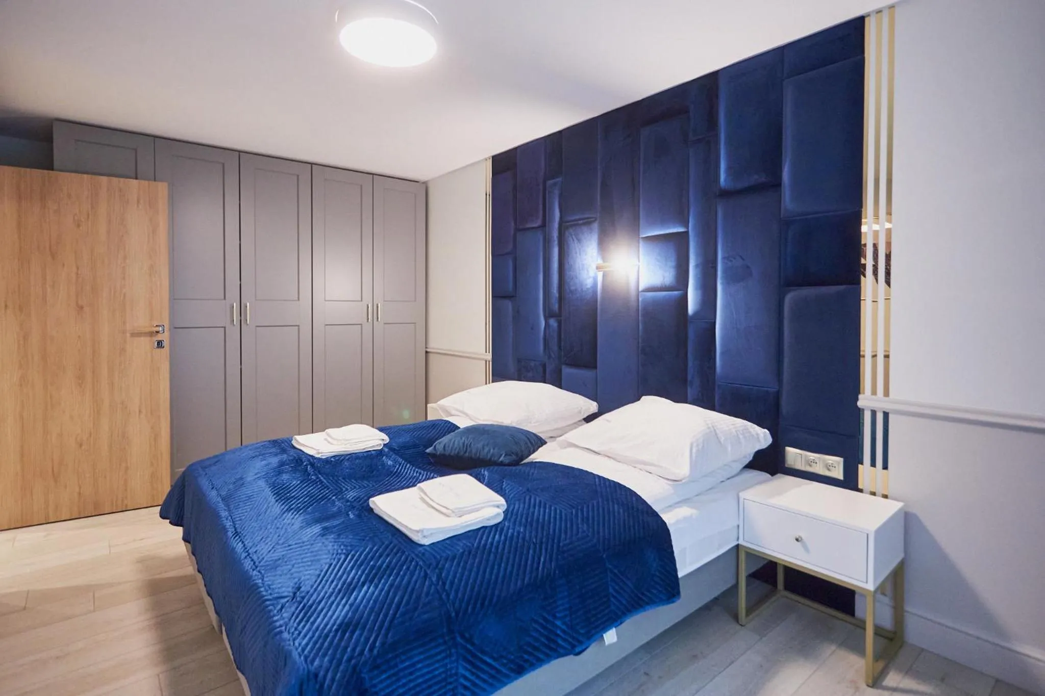 Bed in Timber Apartments by Baltic Home