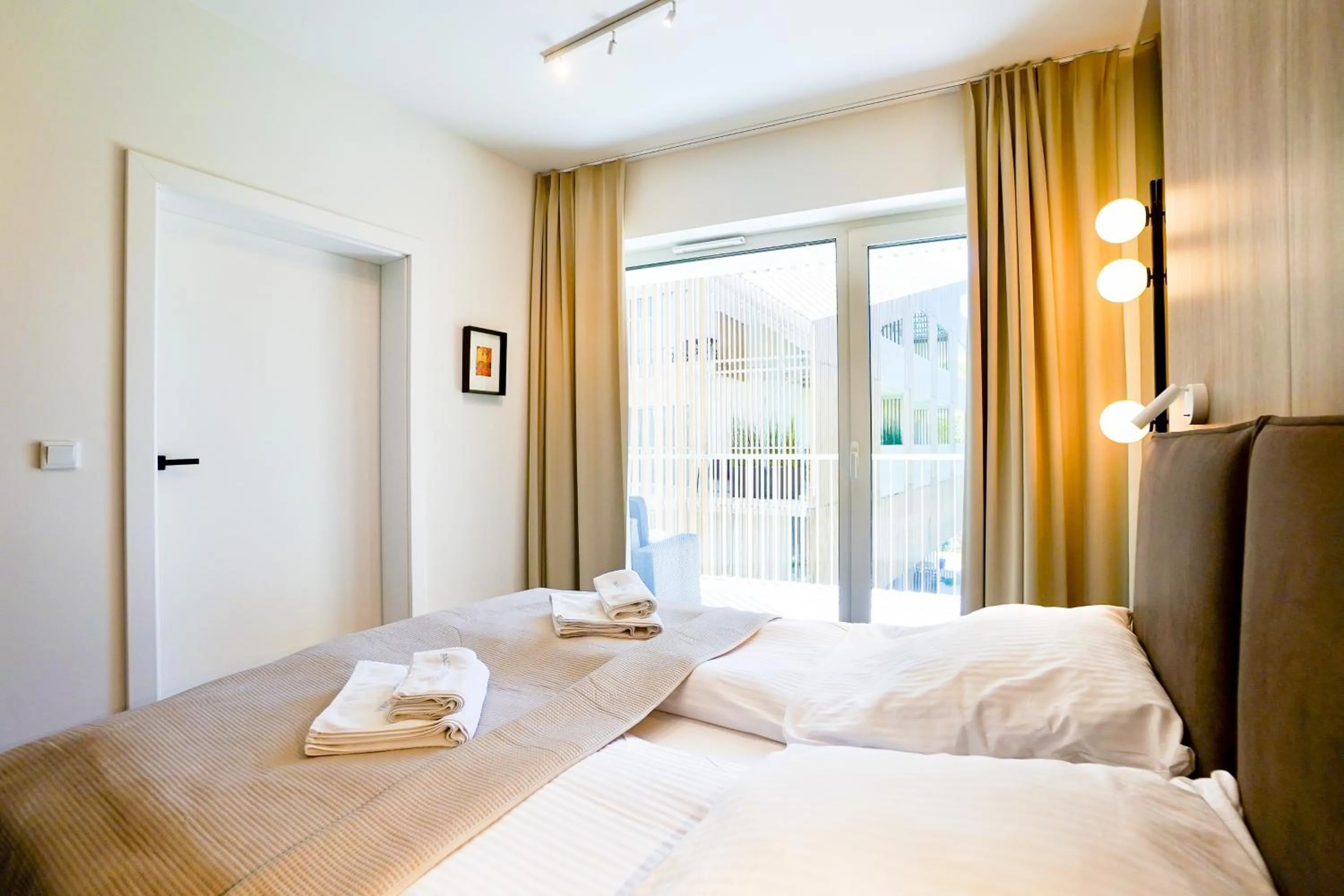 Bed in Timber Apartments by Baltic Home
