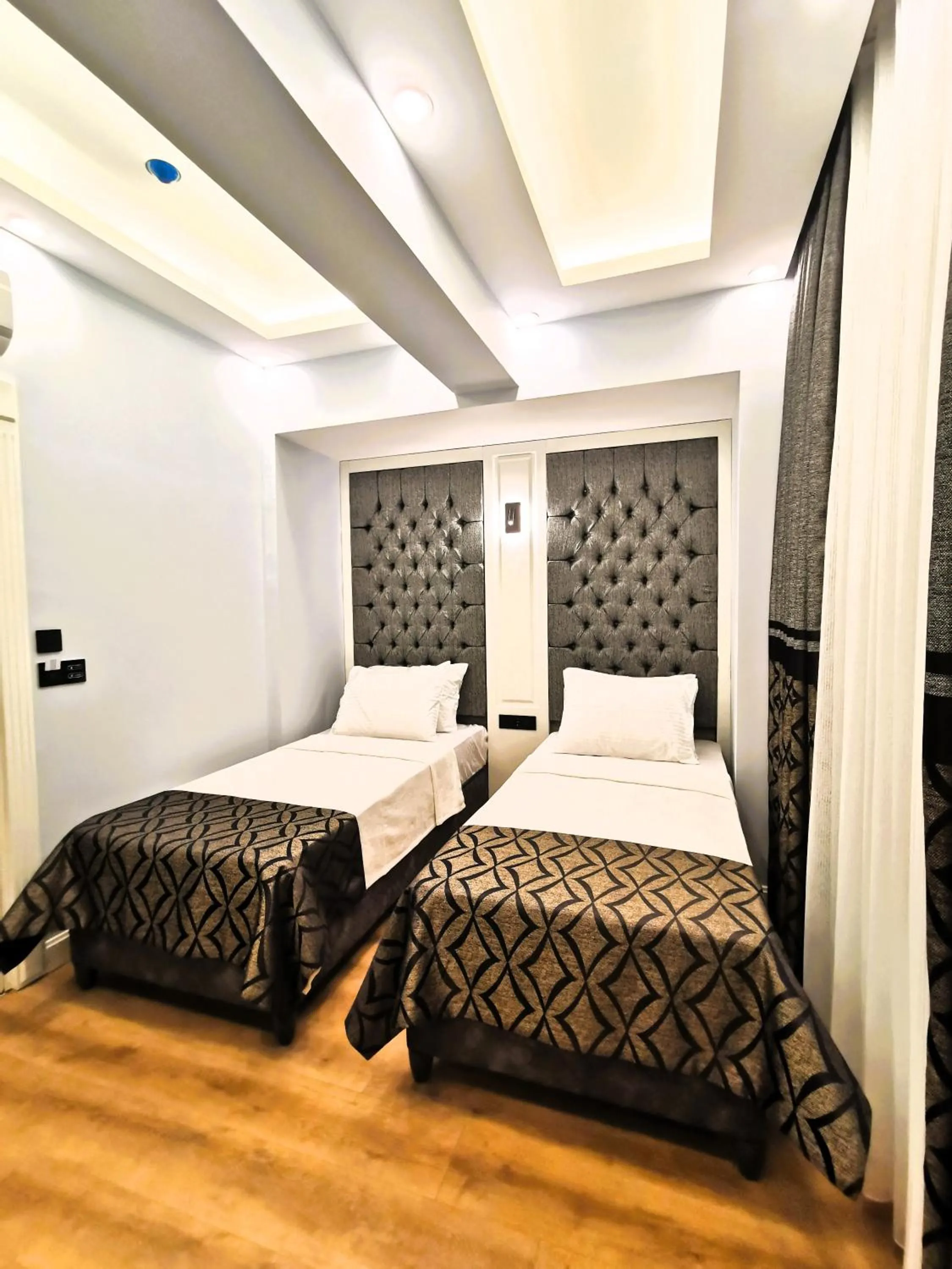 Bed in Luxx Garden Hotel