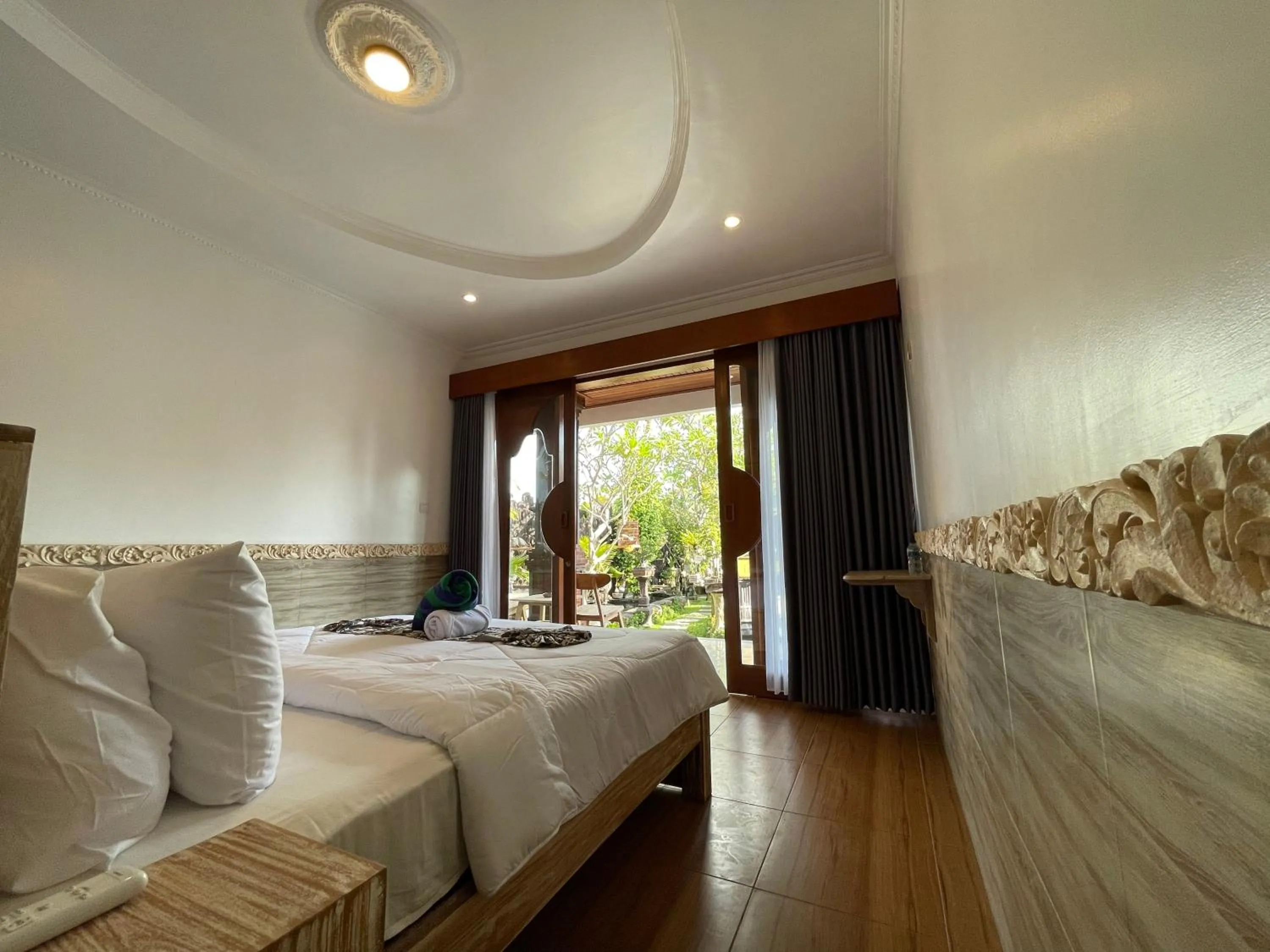 Bed in Mikuk Cottages Canggu