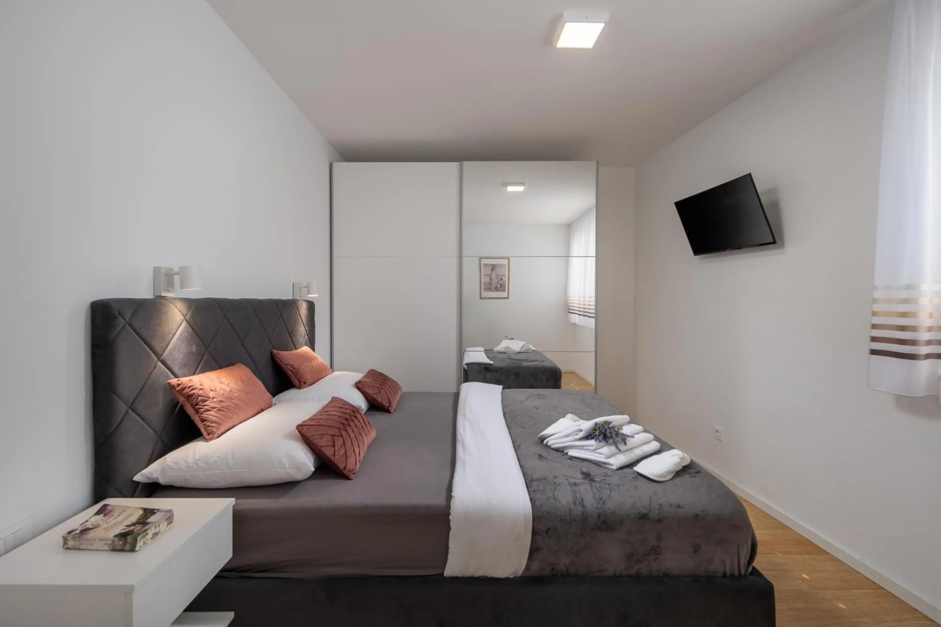 Bed in Luxury apartment Marco Polo with a private swimming pool with salt sea water