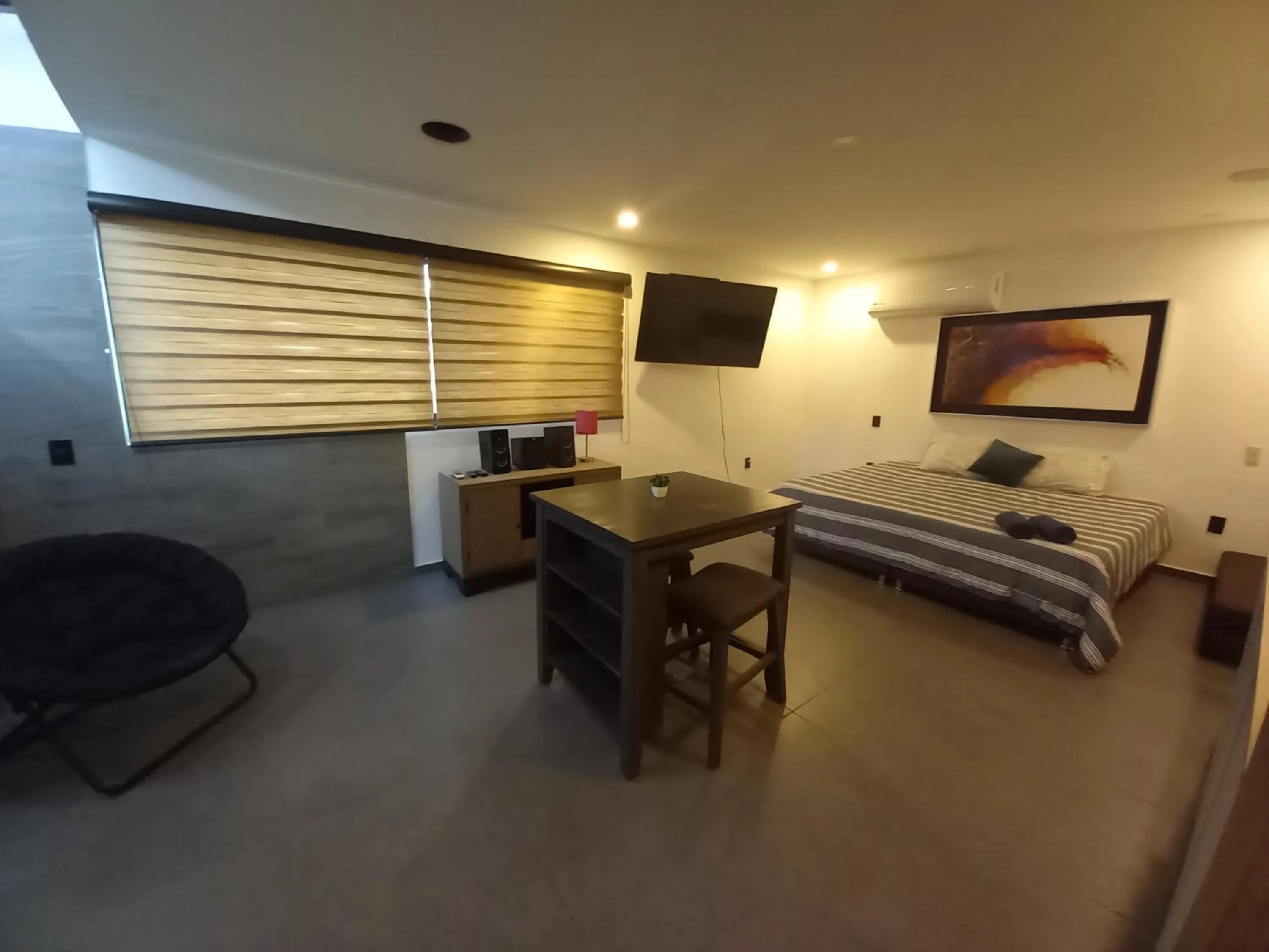 Seating area, Bed in Capital O Tu Estancia